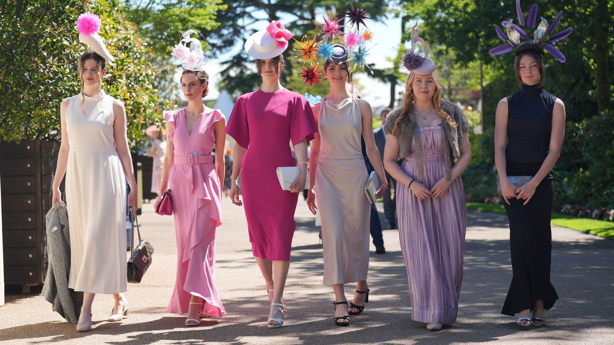 Line of six women entering Ascot for ladies day 
