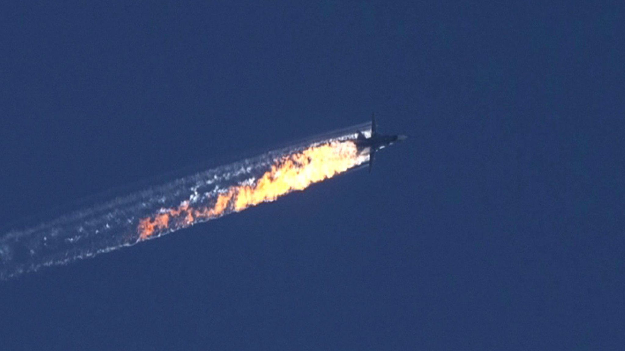 A still from video footage shown by the HaberTurk TV Channel shows a plane coming down near the Turkish-Syrian border on 24 November 2015