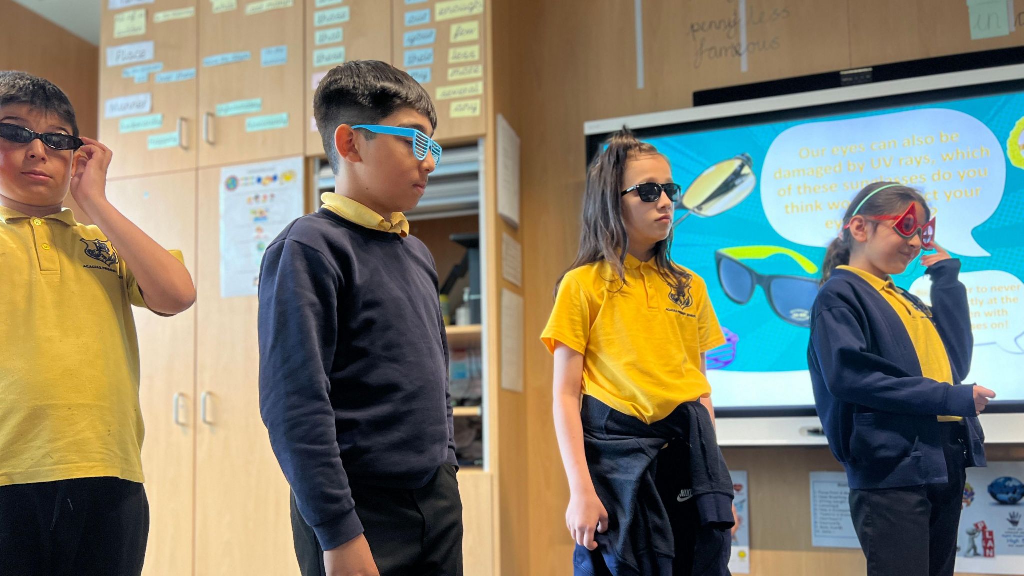 Pupils at Acacias Community Primary School play with sunglasses to learn about their protective qualities
