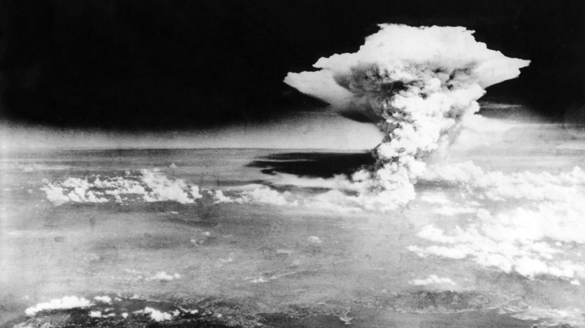 Nuclear explosion over Hiroshima on 6 August 1945. A black and white photograph taken from the sky, showing a huge cloud.