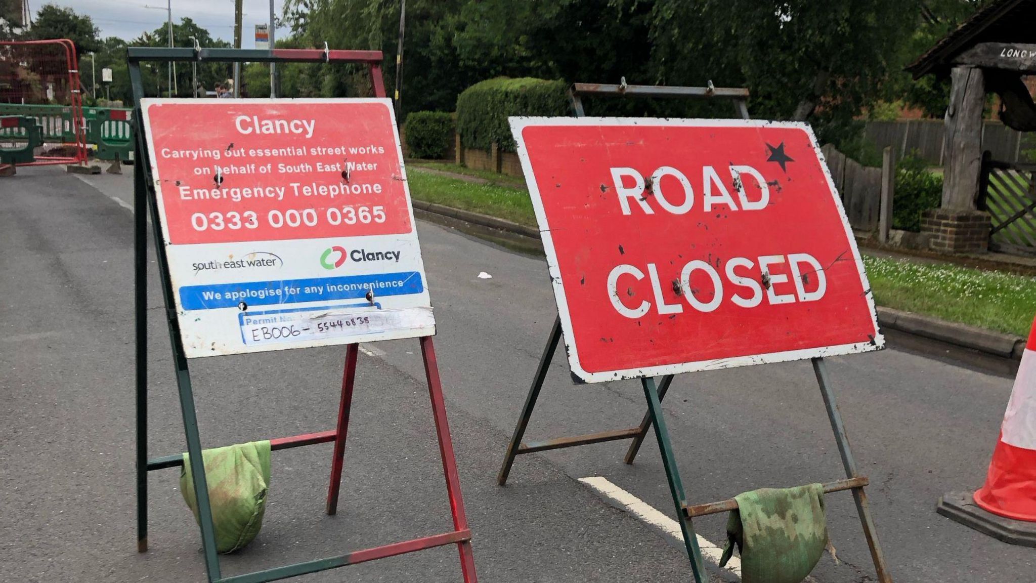 Two road signs indicating that a road is closed