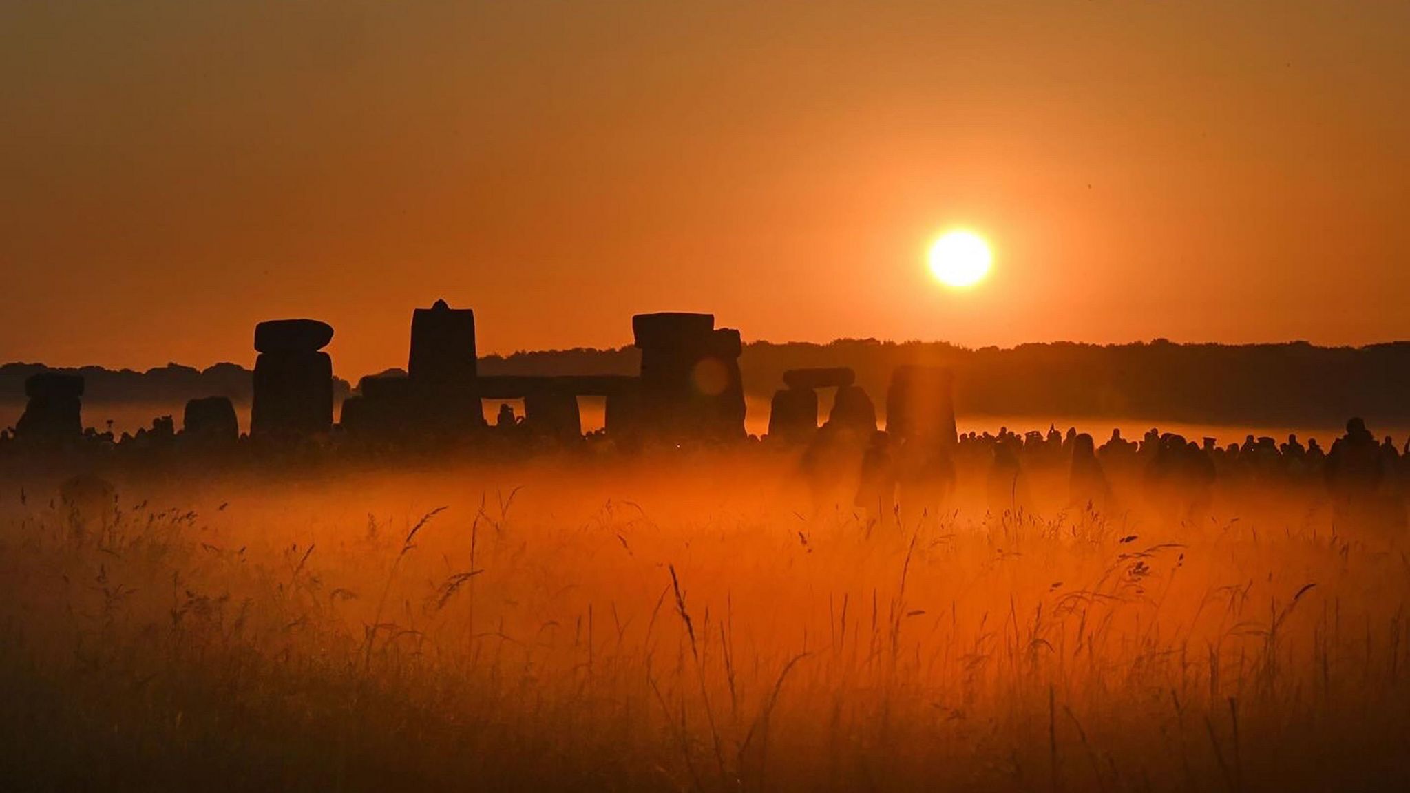 Stonehenge with the sun rising behind it