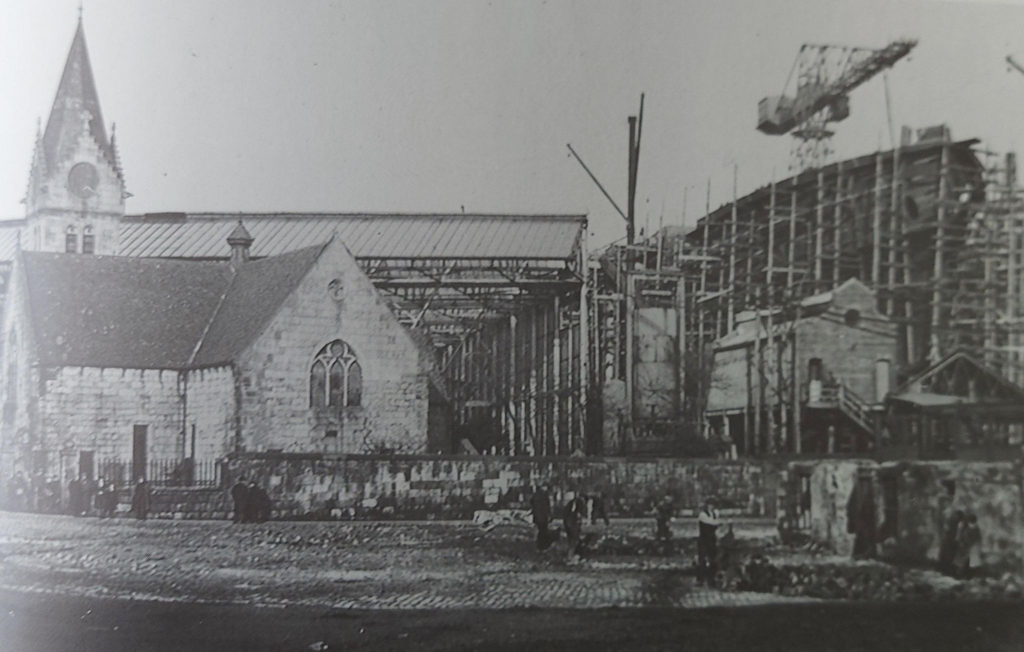 The church in its original site with a ship being built in the background