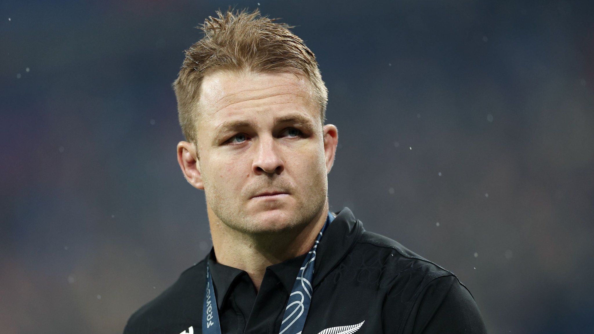 Sam Cane looks into the crowd while wearing his runner-up medal after New Zealand's World Cup final loss to South Africa