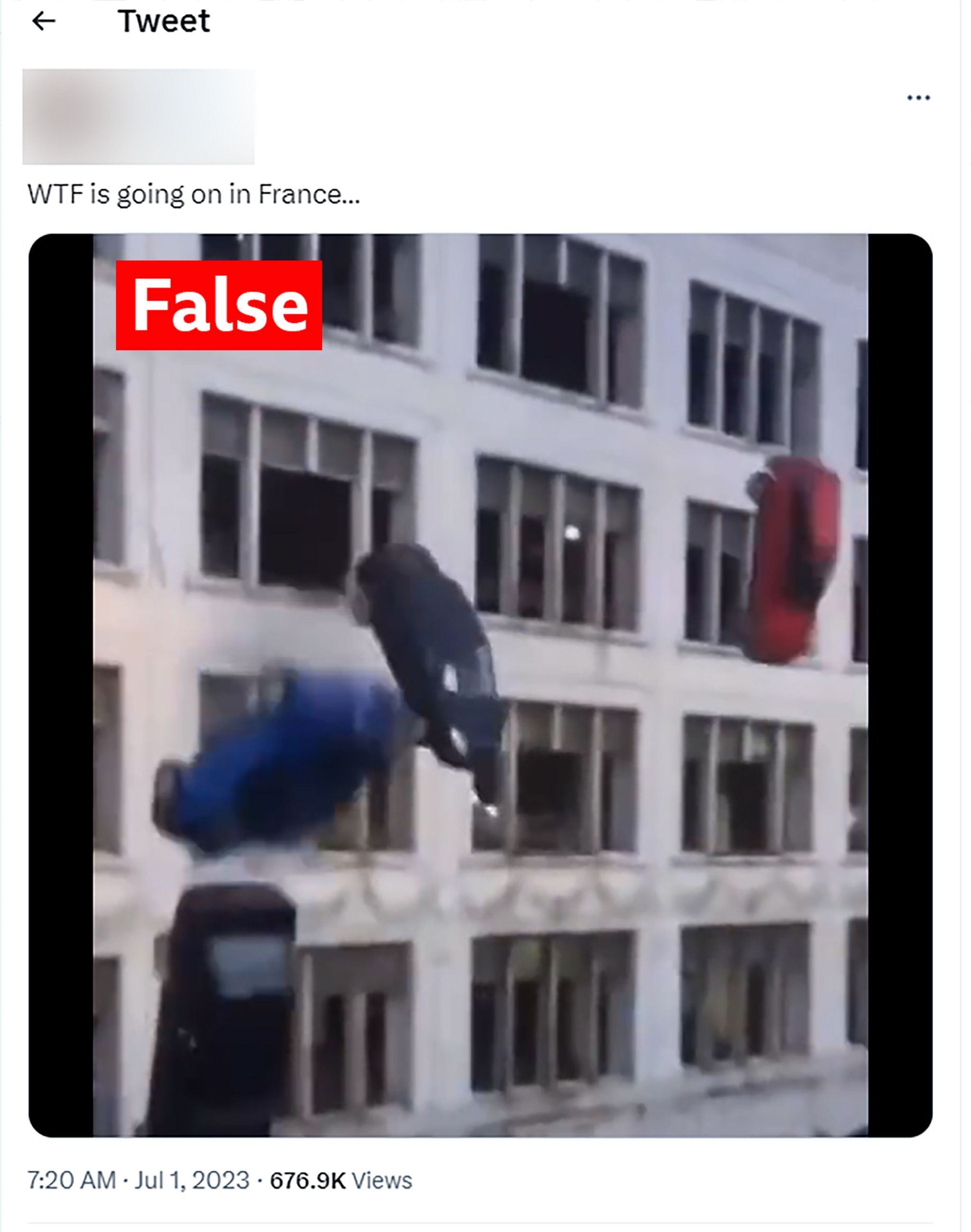 An image of cars falling from a multi-storey car park, taken from a tweet and labelled "false"