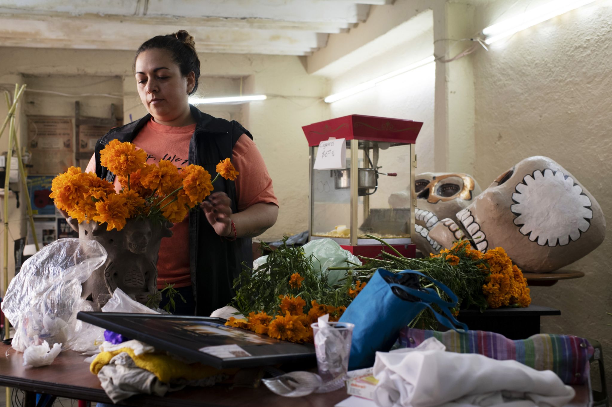 Malinali Garcia, who is part of the Tepito cultural space, is making preparations to put on the traditional offering for the Day of the Dead