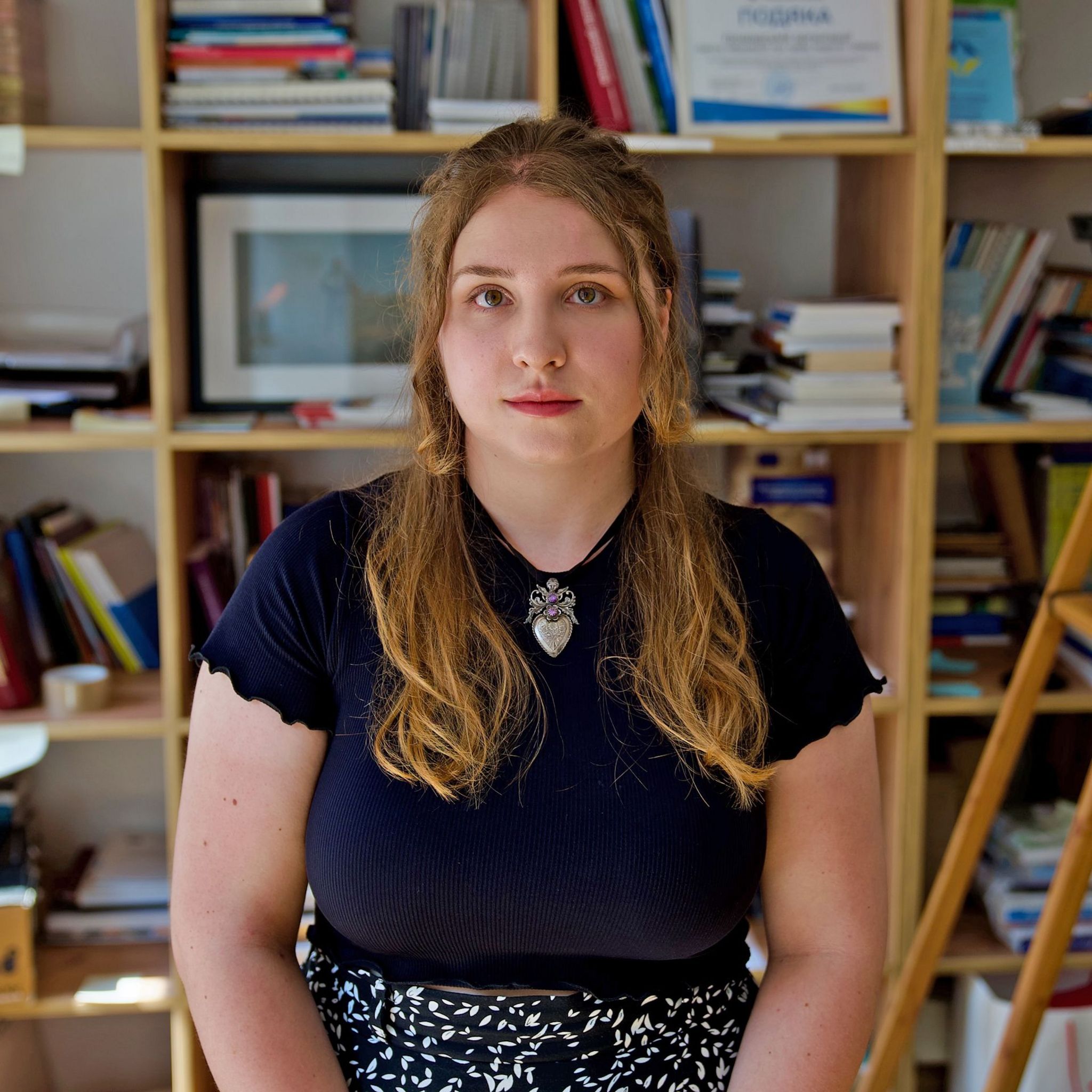 Onysiya Syniuk, a legal expert at the Zmina Human Rights Centre in Kyiv, in her office lined with books 