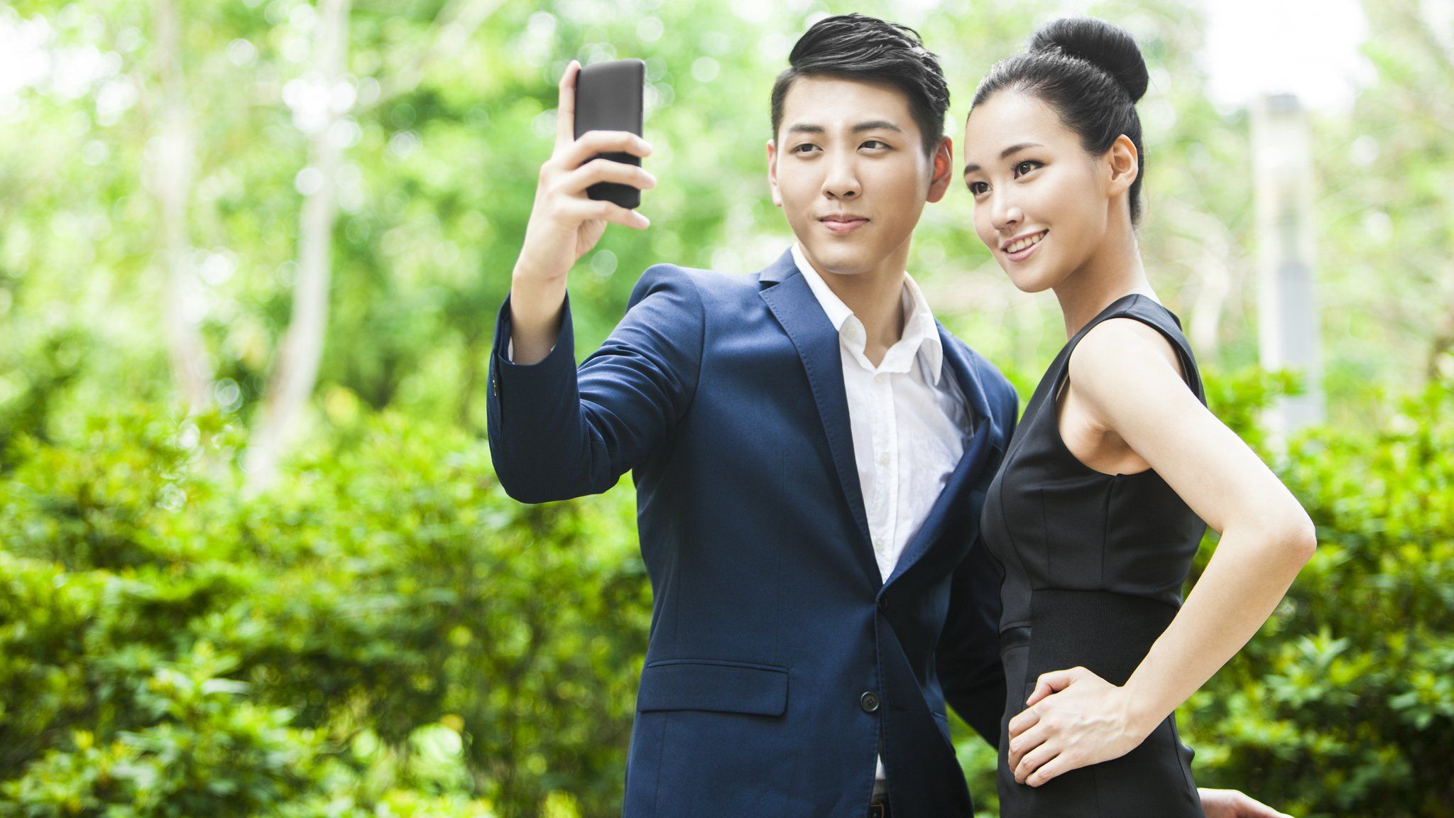 Attractive Chinese couple taking a selfie