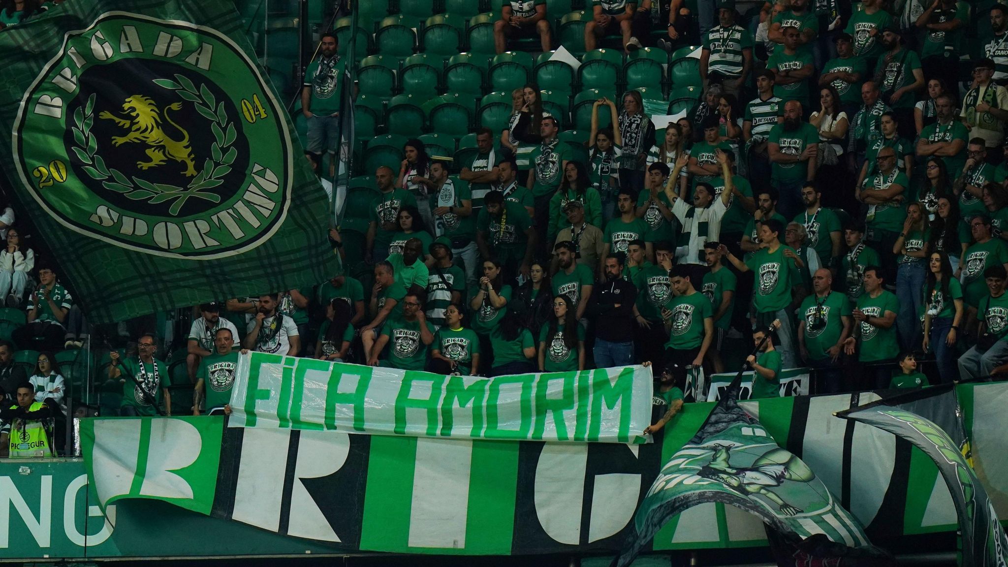 Sporting Lisbon fans with banners about Ruben Amorim