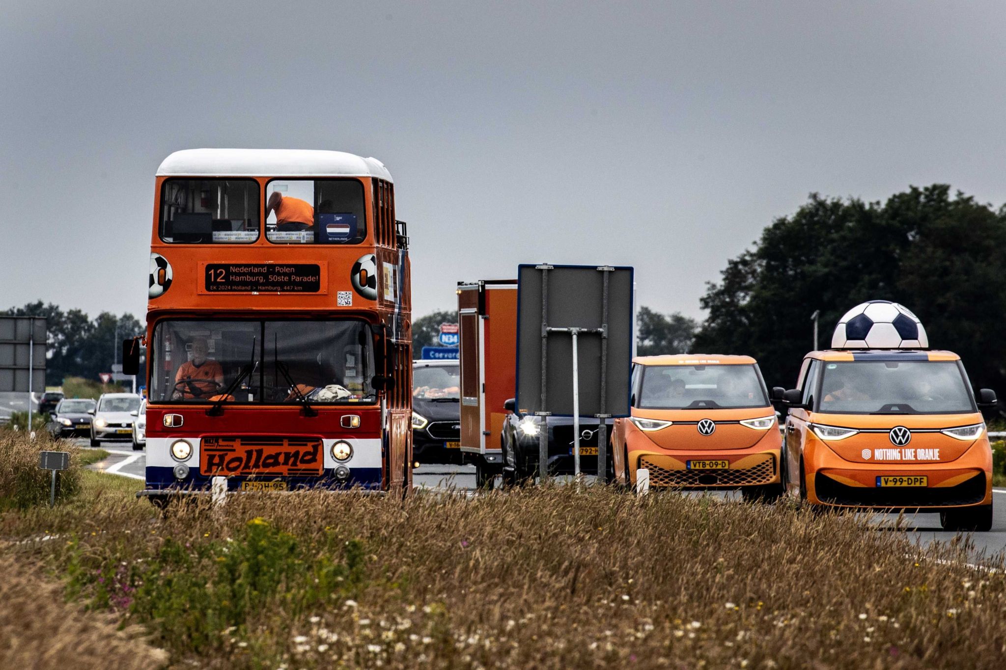 Dutch fans travel to Germany in an orange convoy of vehicles