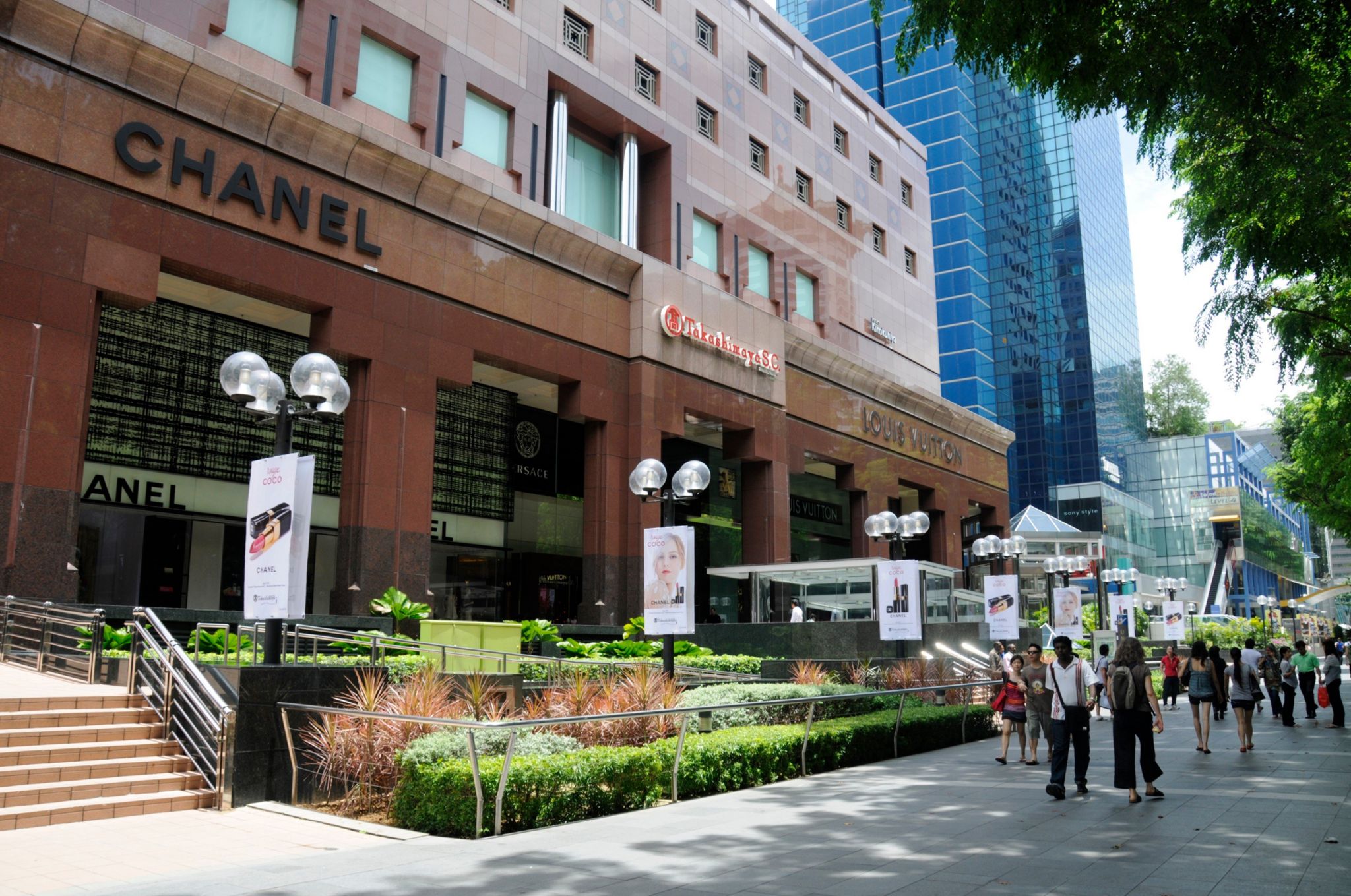 Stores in Orchard Road shopping street in Singapore. Orchard Road is a road in Singapore that is the retail and entertainment hub of the city-state