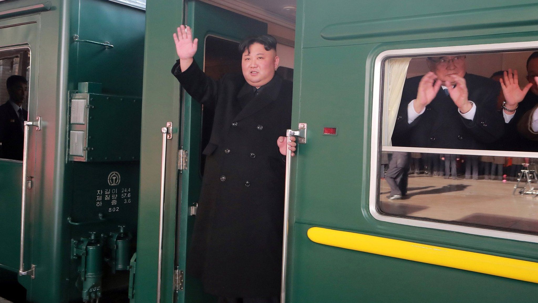 Kim Jong-un waves from train as it leaves Pyongyang - photo released by KCNA news agency 23 February