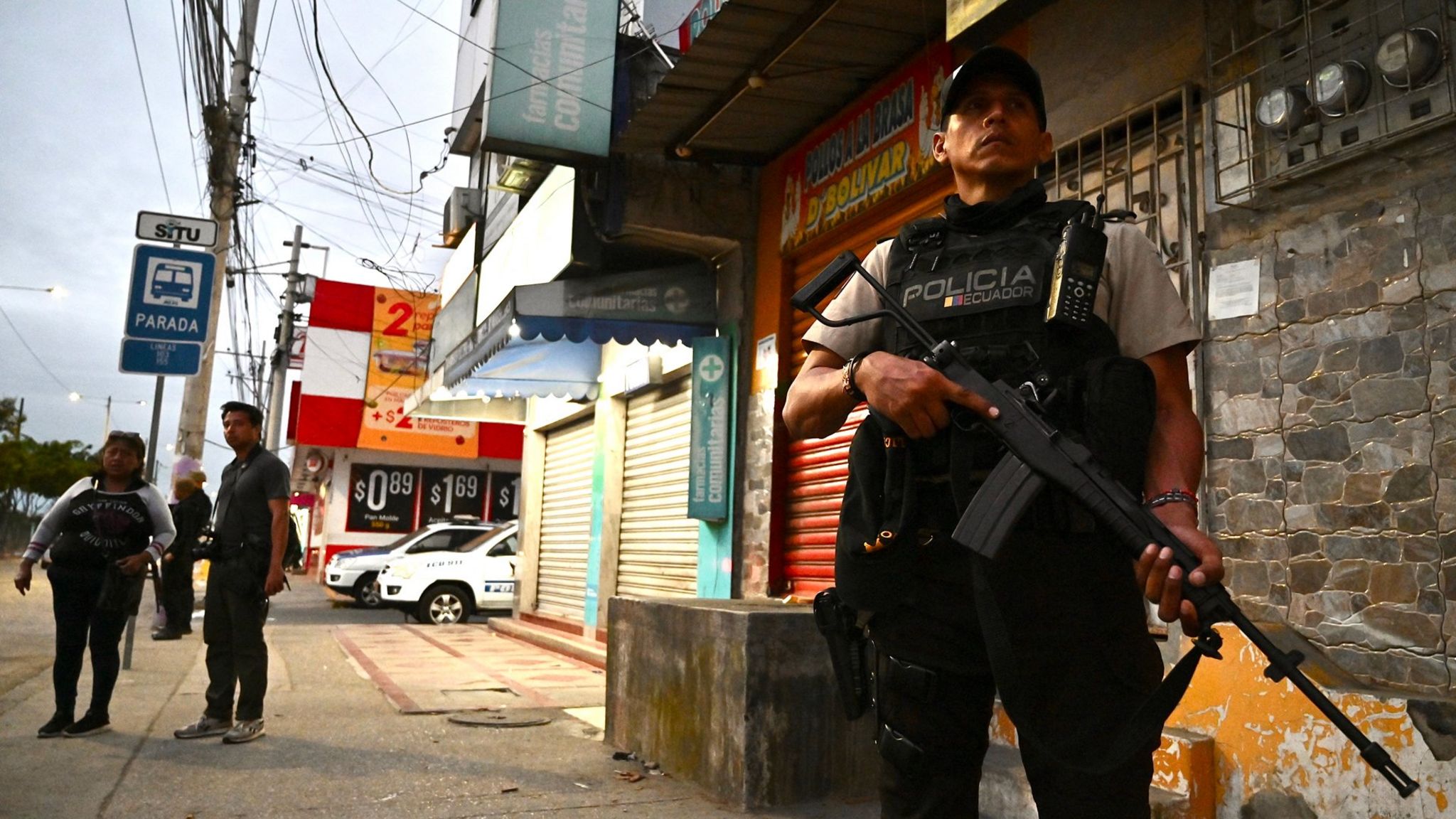 Police officers stand guard during a security operation in Guayaquil, Ecuador, on April 1, 2024