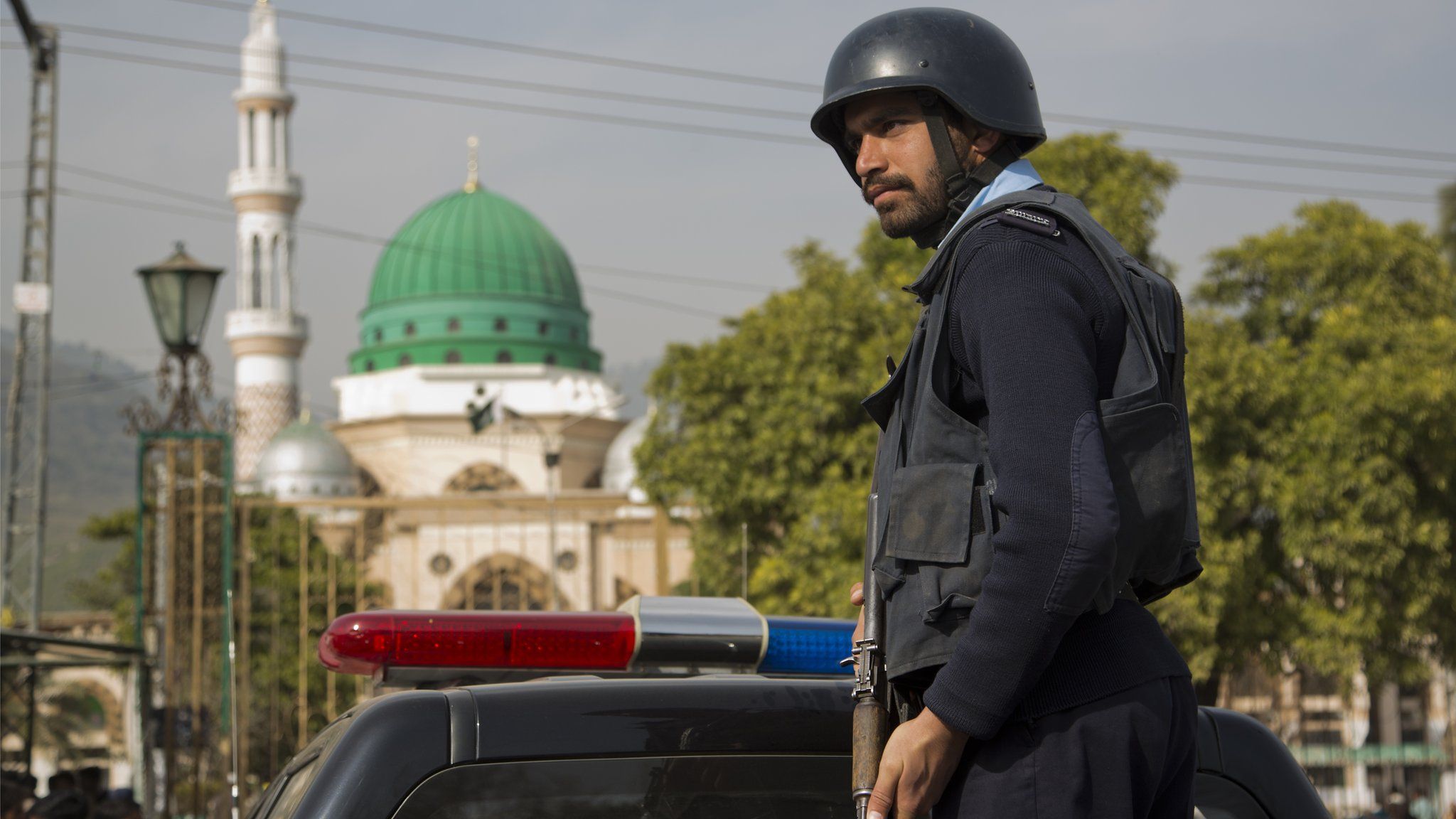 A Pakistani police officer stands guard outside the Barri Imam shrine, as security is beefed up in the capital following a suicide attack at a Sufi shrine in interior Sindh, Islamabad, Pakistan, Friday, 17 Feb 2017