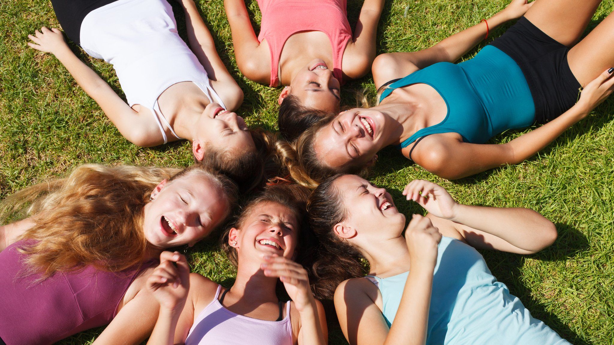 A group of happy girls lying down