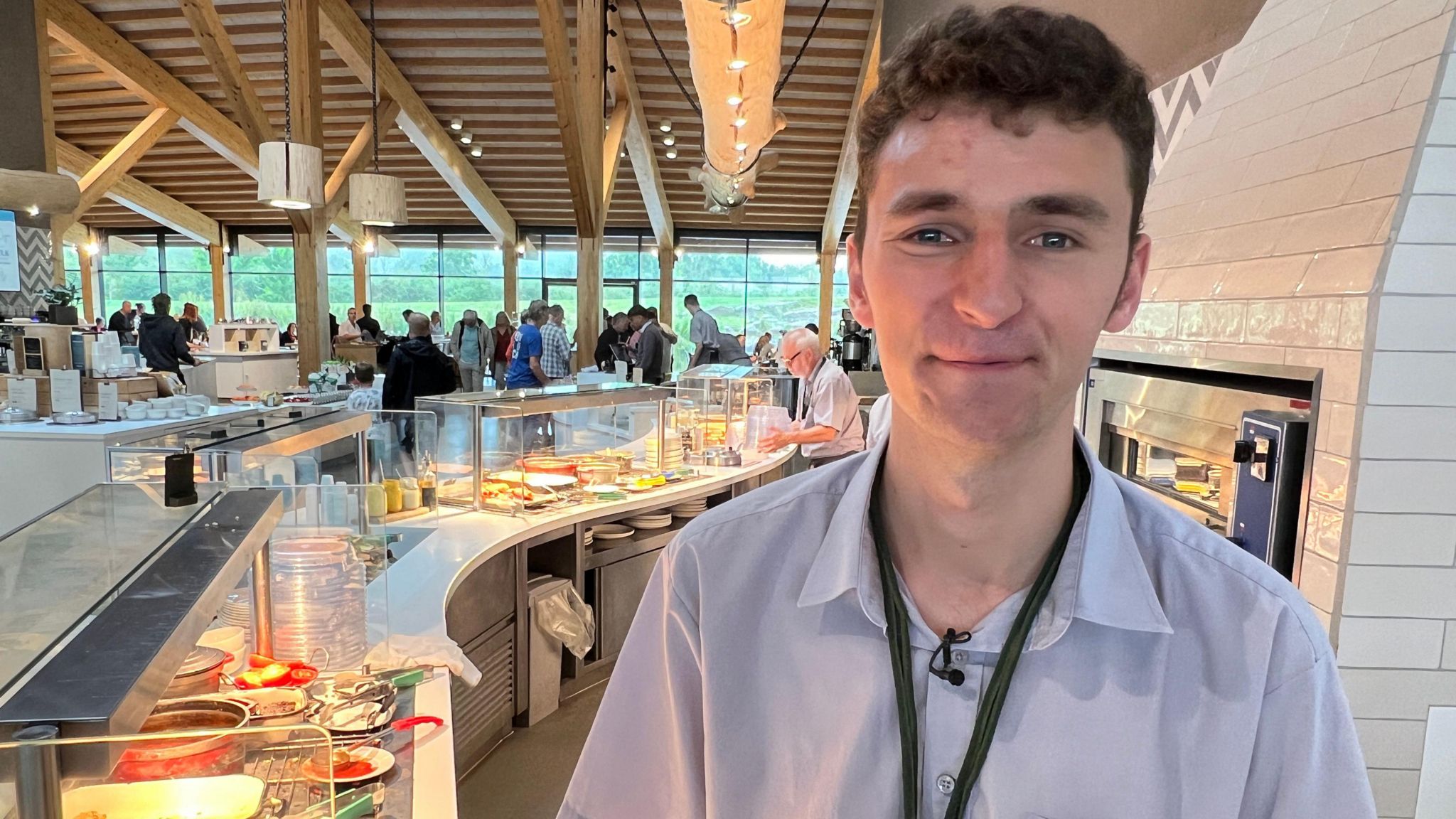 Ryan Dix stood behind the counter at the cafe at Gloucester Services