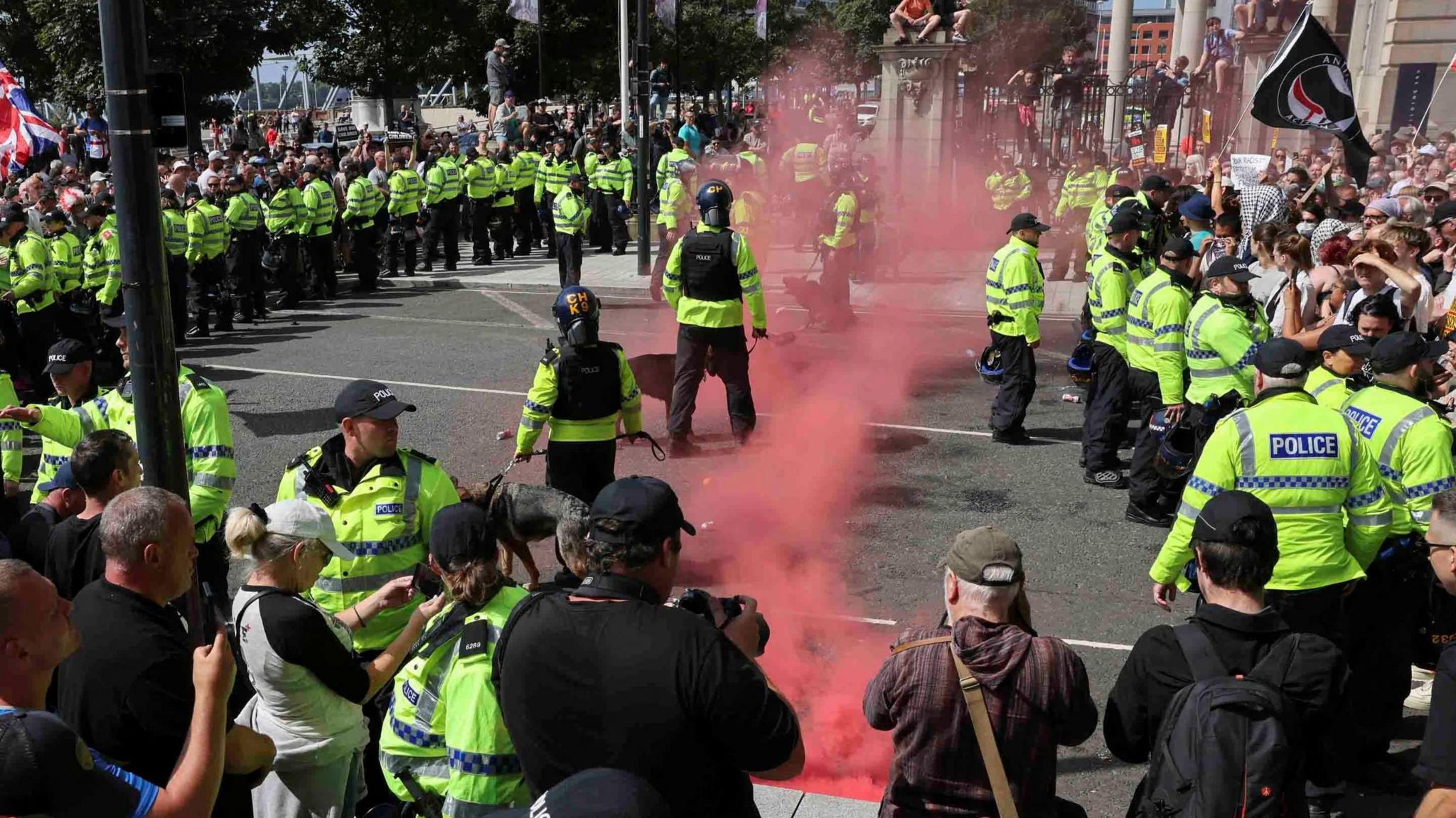 Police officers and demonstrators face-off in Liverpool.