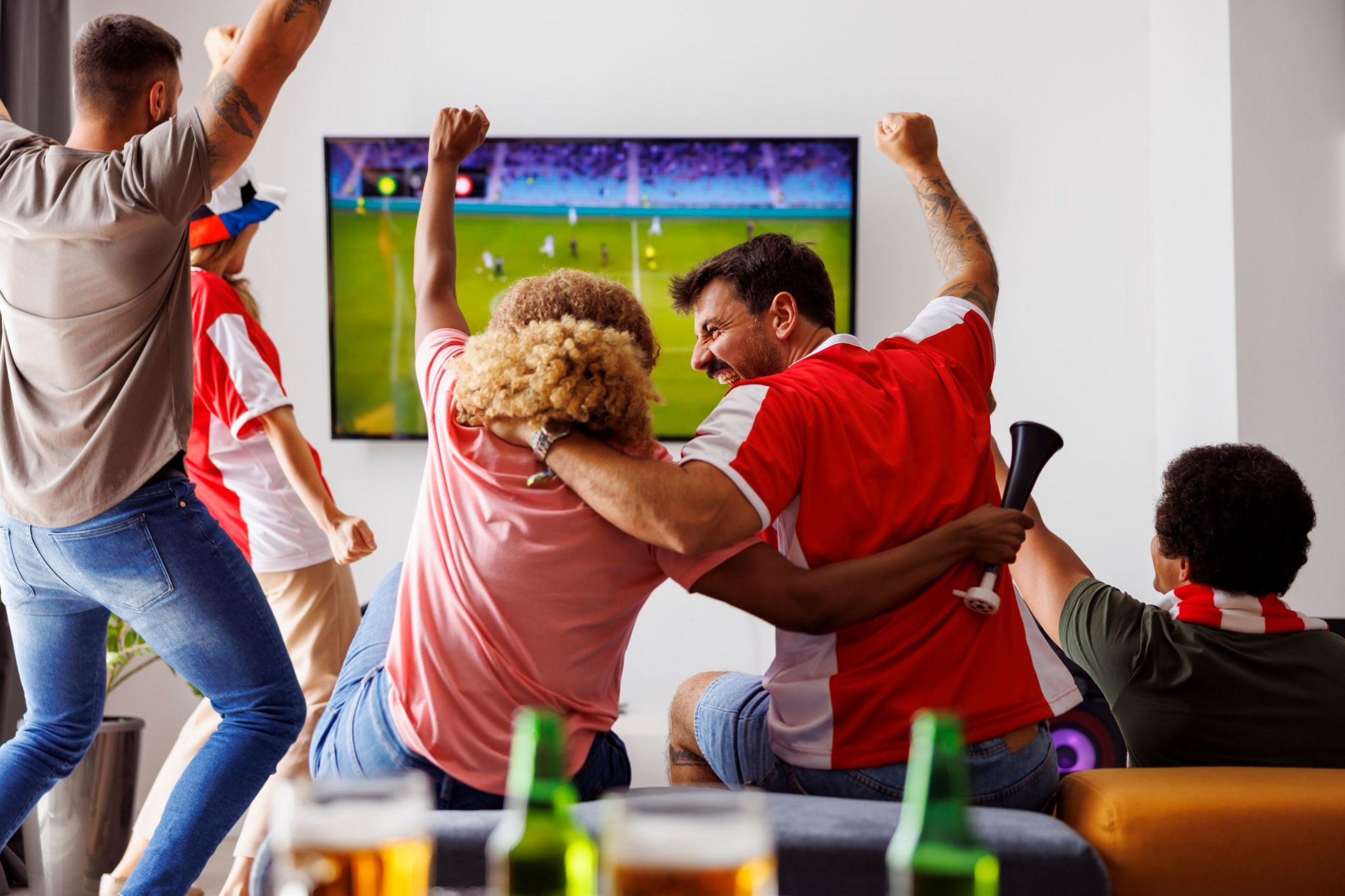 Fans watching football on the TV