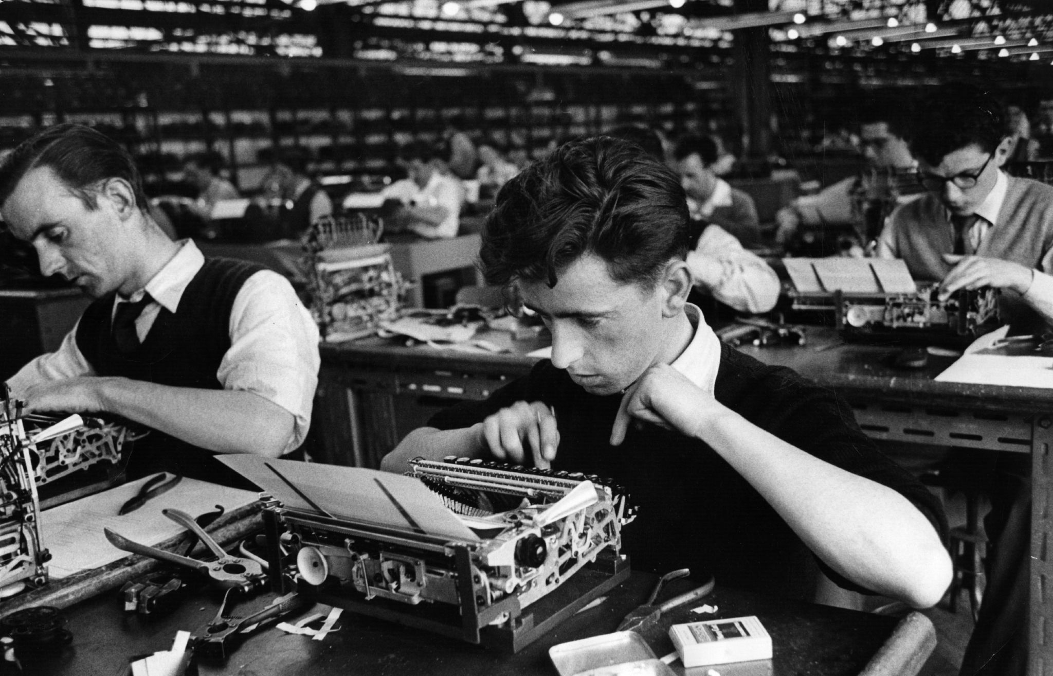 20th August 1955: Employees of British Olivetti Ltd testing typewriters at the company's factory on the Queenslie Industrial Estate in Clydeside, Glasgow. The factory is highly modernised and makes machines primarily for export to Australia, New Zealand and Africa. Original Publication: Picture Post - 7942 - Let Glasgow Flourish! - pub. 1955 (Photo by Haywood Magee/Picture Post/Hulton Archive/Getty Images)