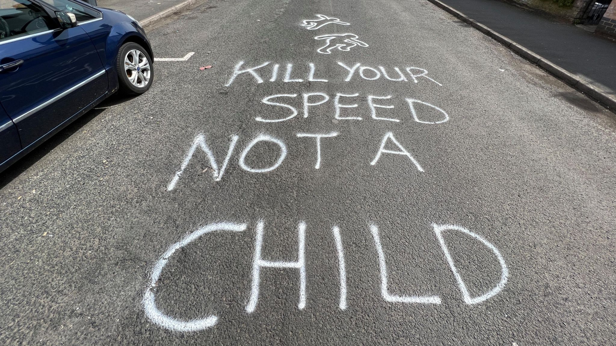 Graffiti on Westfield Road in Kings Heath reading 'Kill your speed not a child'