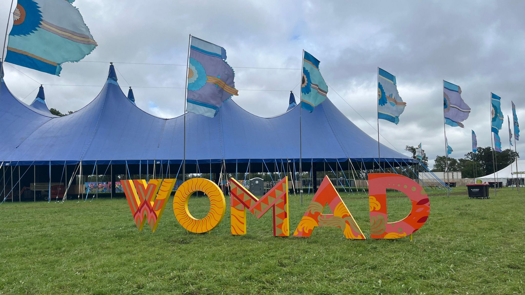 A large marquee and WOMAD sign