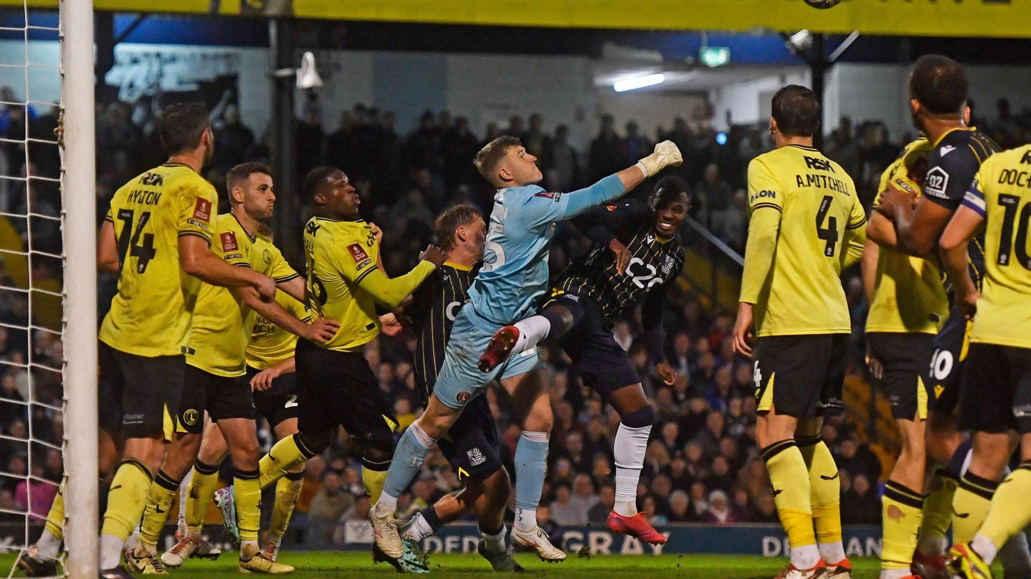 Charlton Athletic keeper Will Mannion punches clear under further Southend pressure in his goalmouth