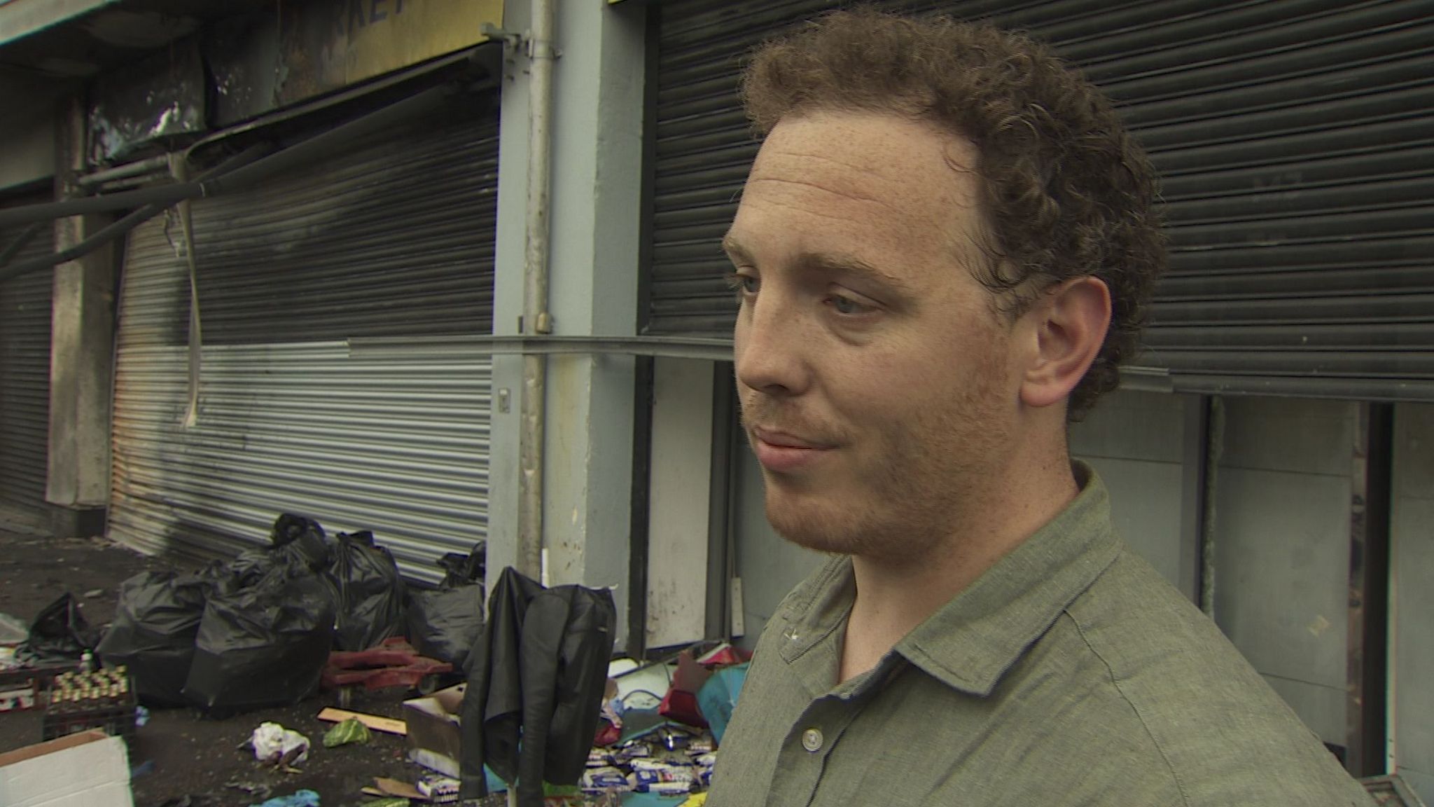 Daniel Lannon outside one of the businesses that was targeted