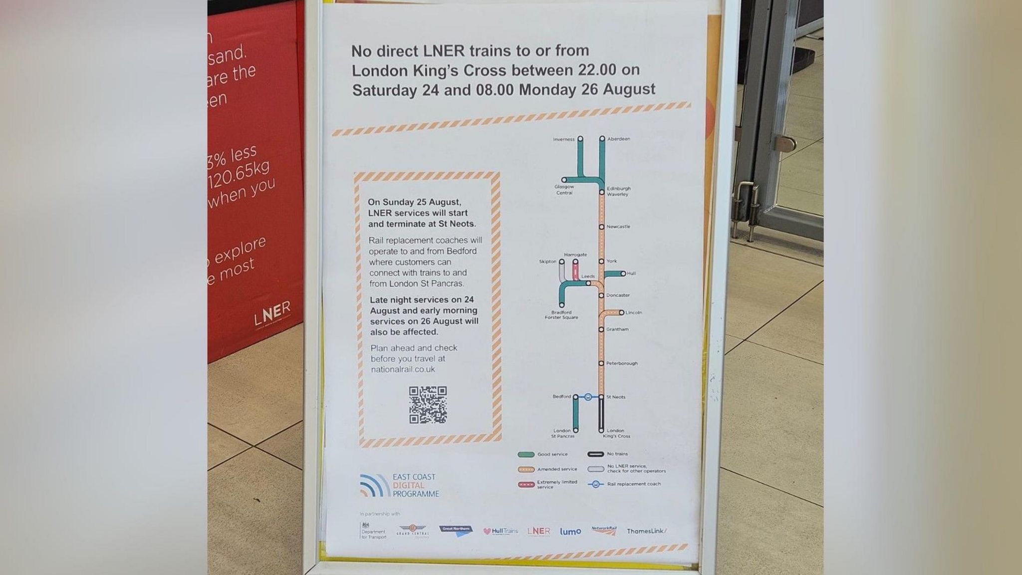 A poster on a white stand with information about the train disruption