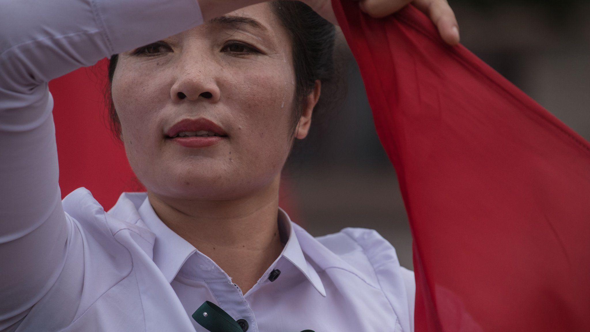 A member of a local propaganda troupe performs in a public square as part of a 200 day campaign aimed at kickstarting a new economic plan, in Pyongyang on July 10, 2016