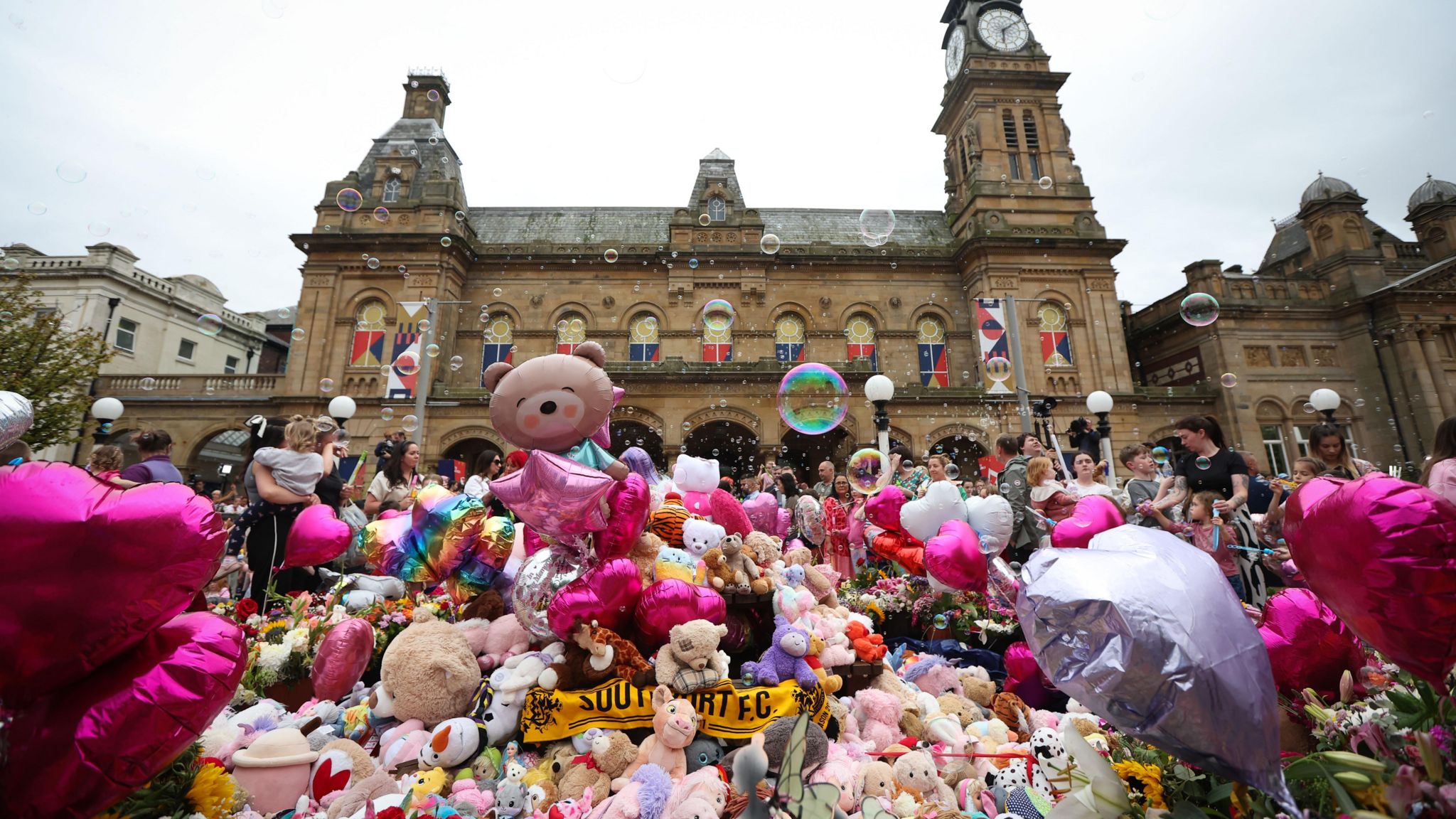 Tributes left outside The Atkinson during a vigil for the victims of the Southport knife attack