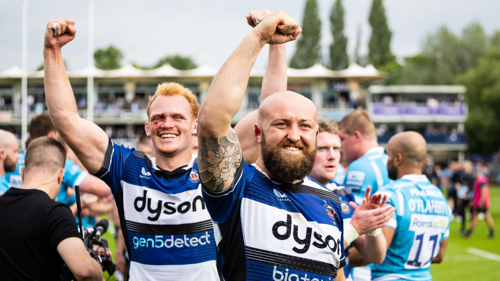 Miles Reid (left) and Tom Dunn lift their arms in the air in celebration after beating Sale