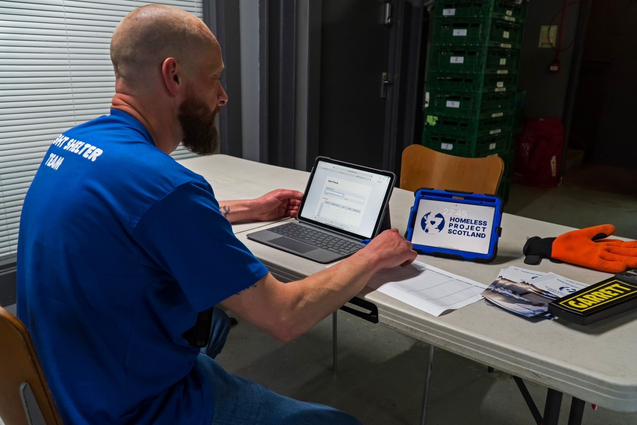 homeless project scotland worker at desk 