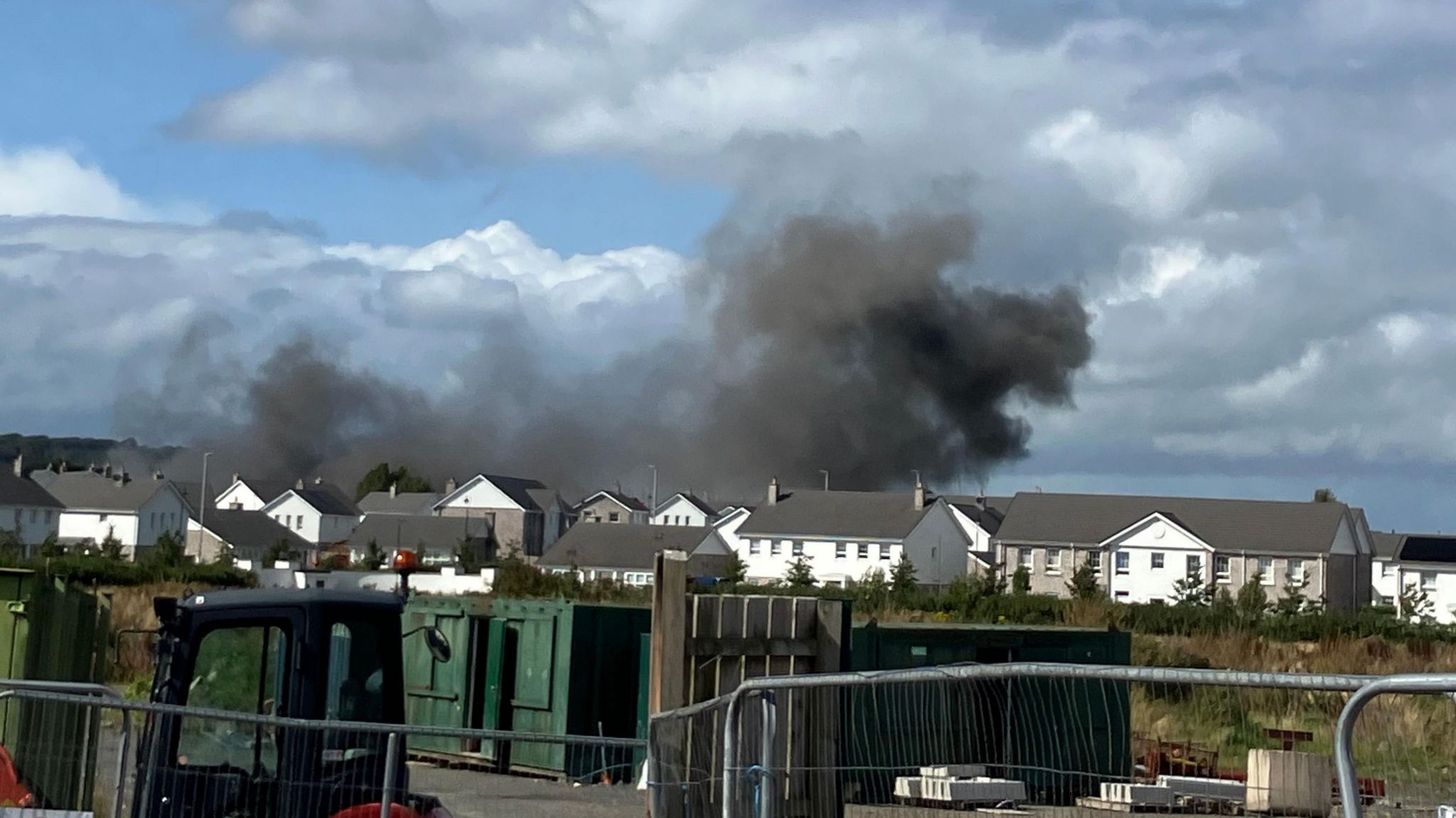 Explosion in Newtownards, County Down, large black flume above housing estate