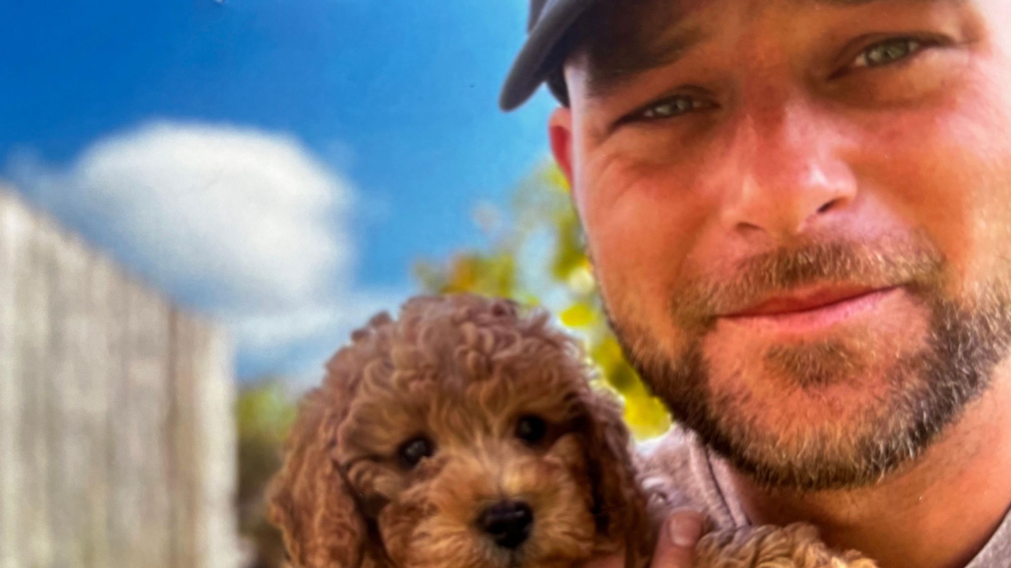 Alex Chadwick holding a puppy