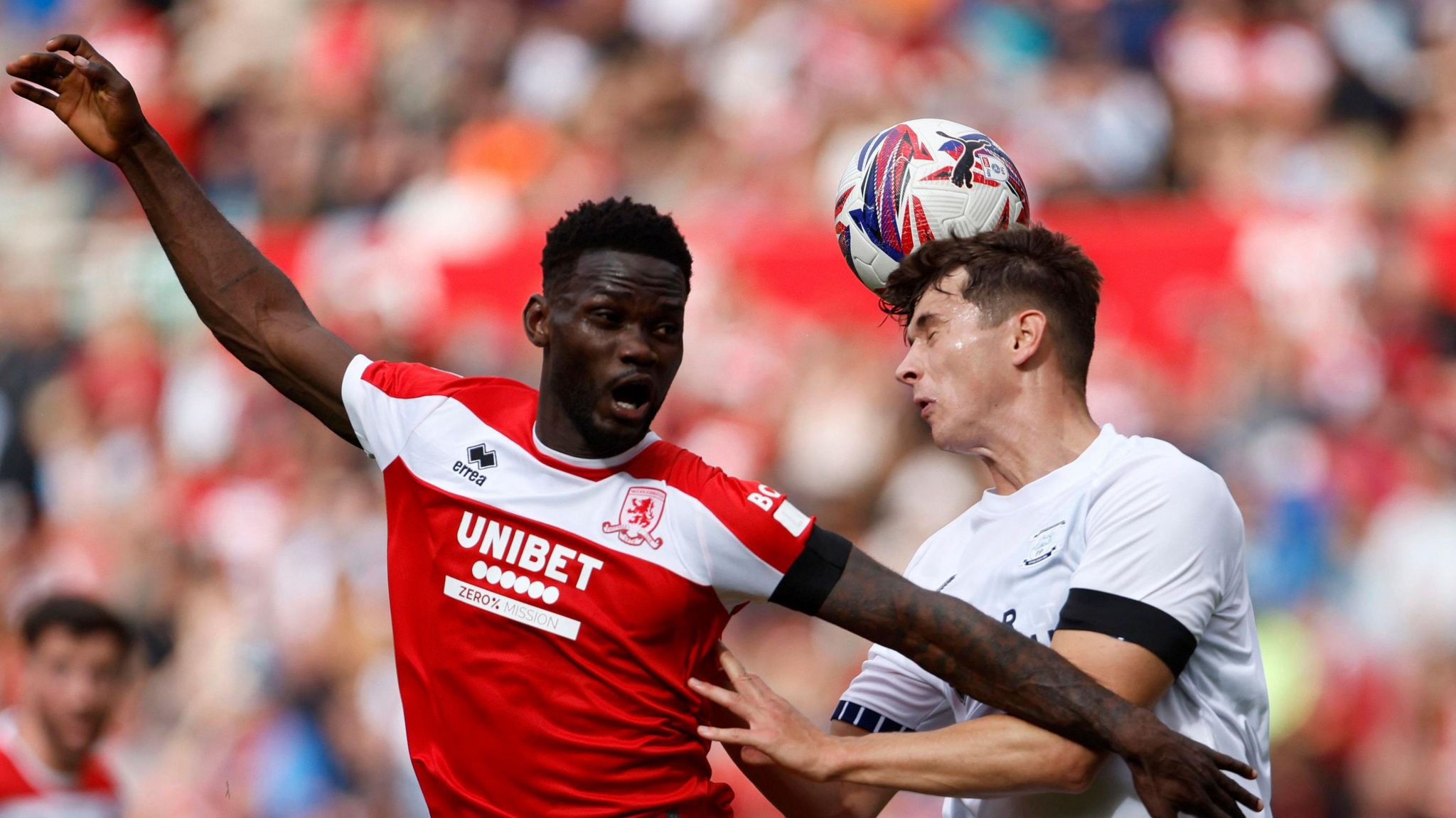 Middlesbrough's Emmanuel Latte Lath and Preston North End's Jordan Store battle for the ball