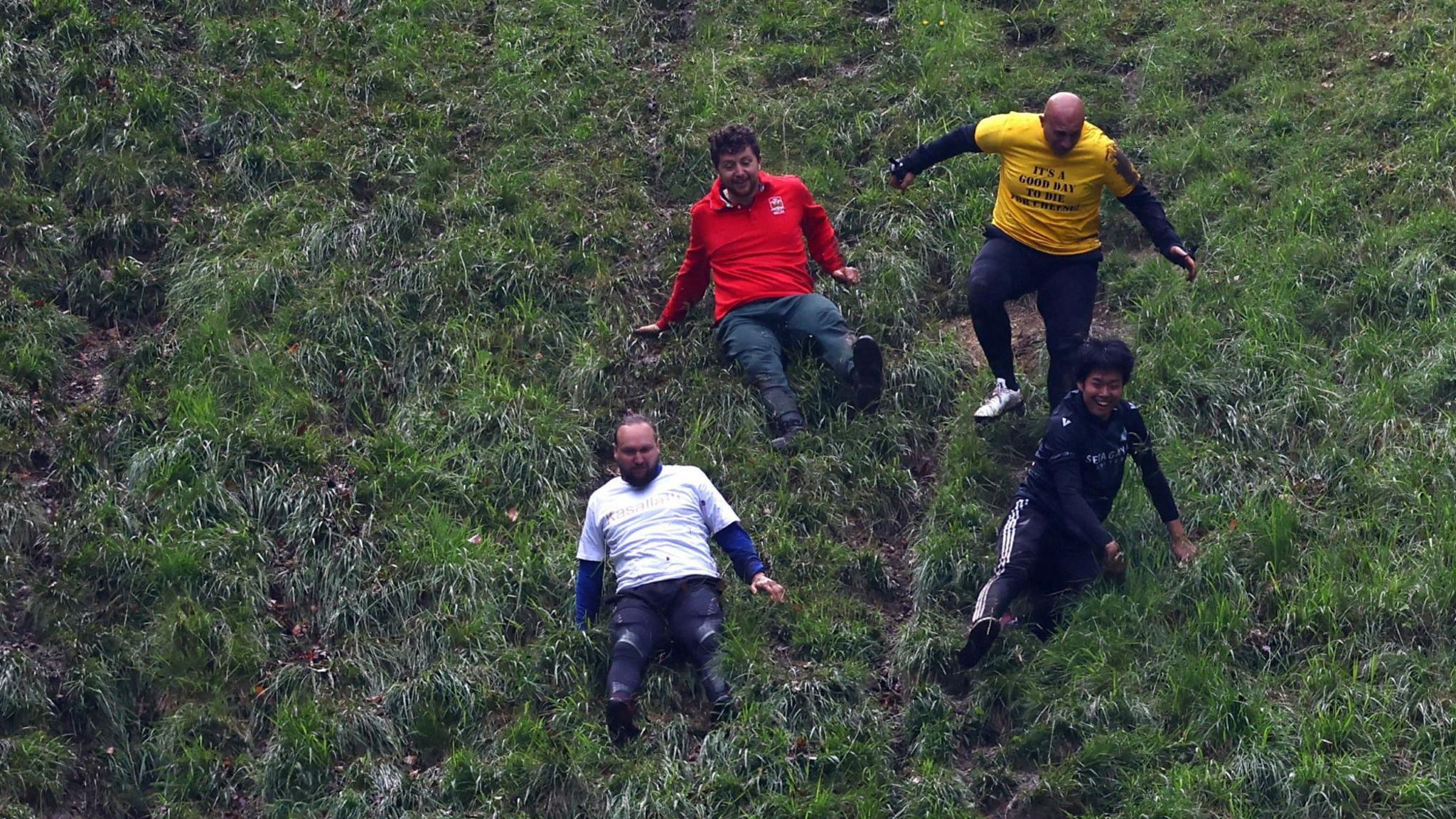 Four men on their way down the hill