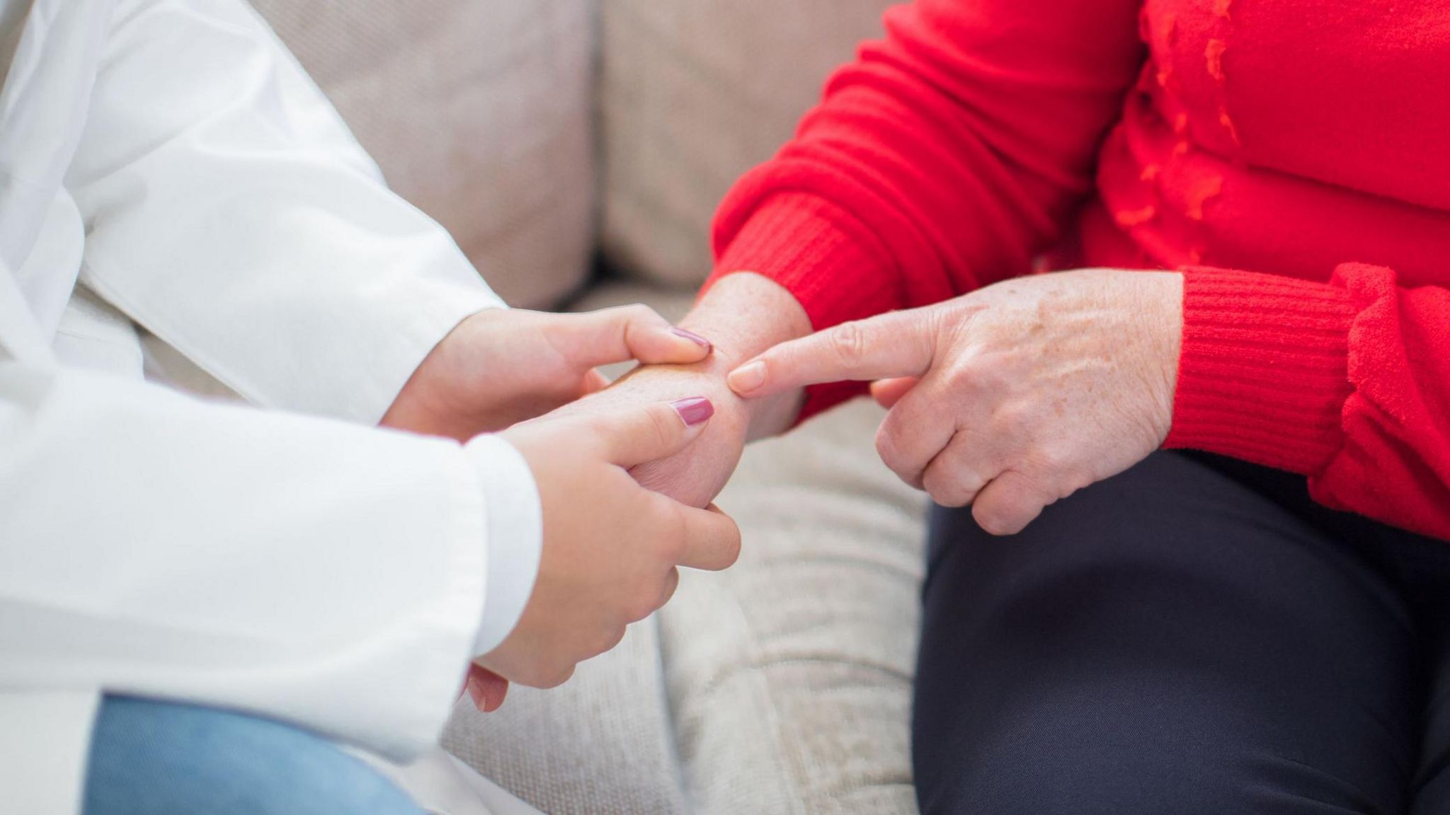 Clinician examing a patient's wrist