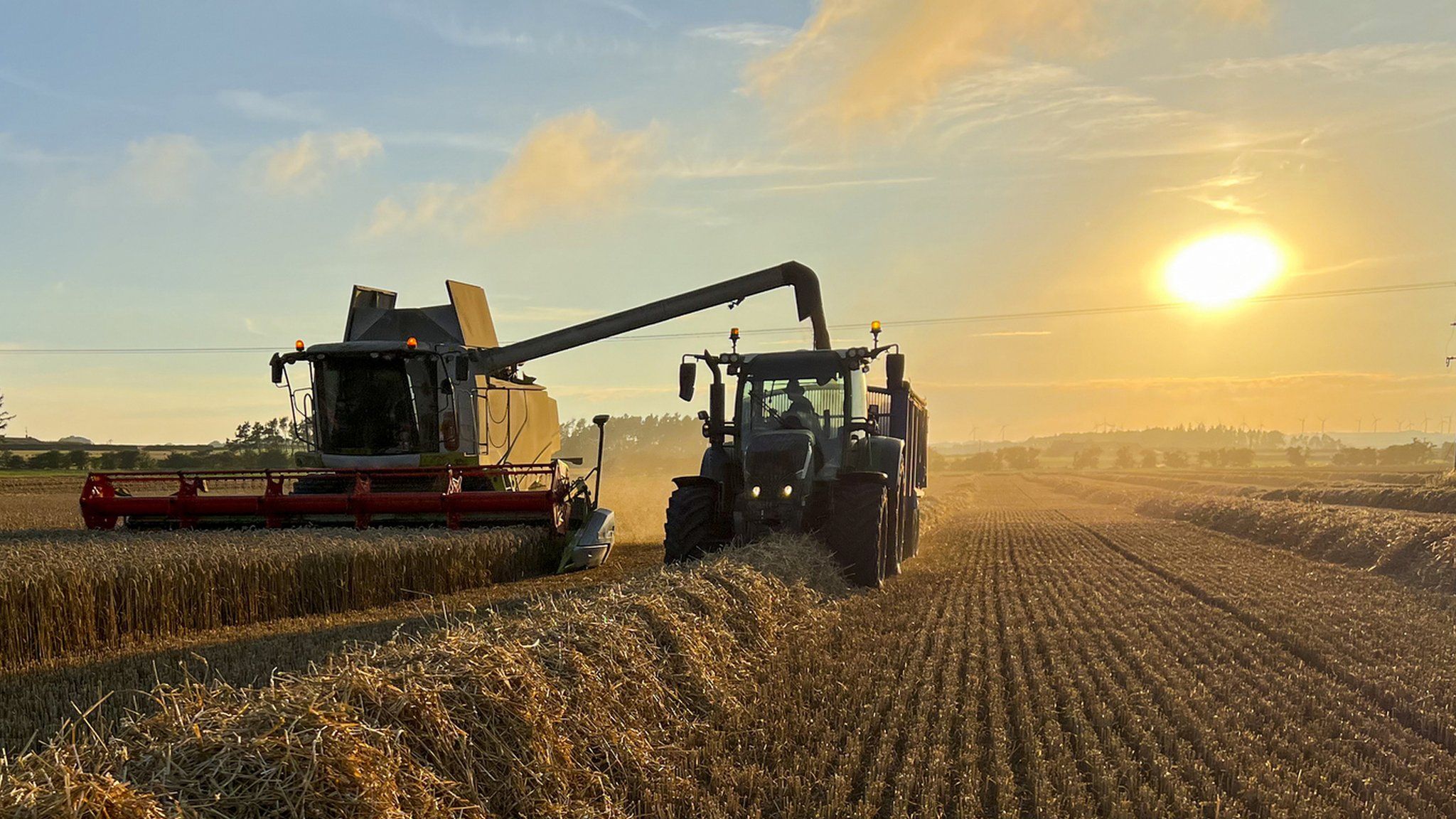 A combine harvester and tractor