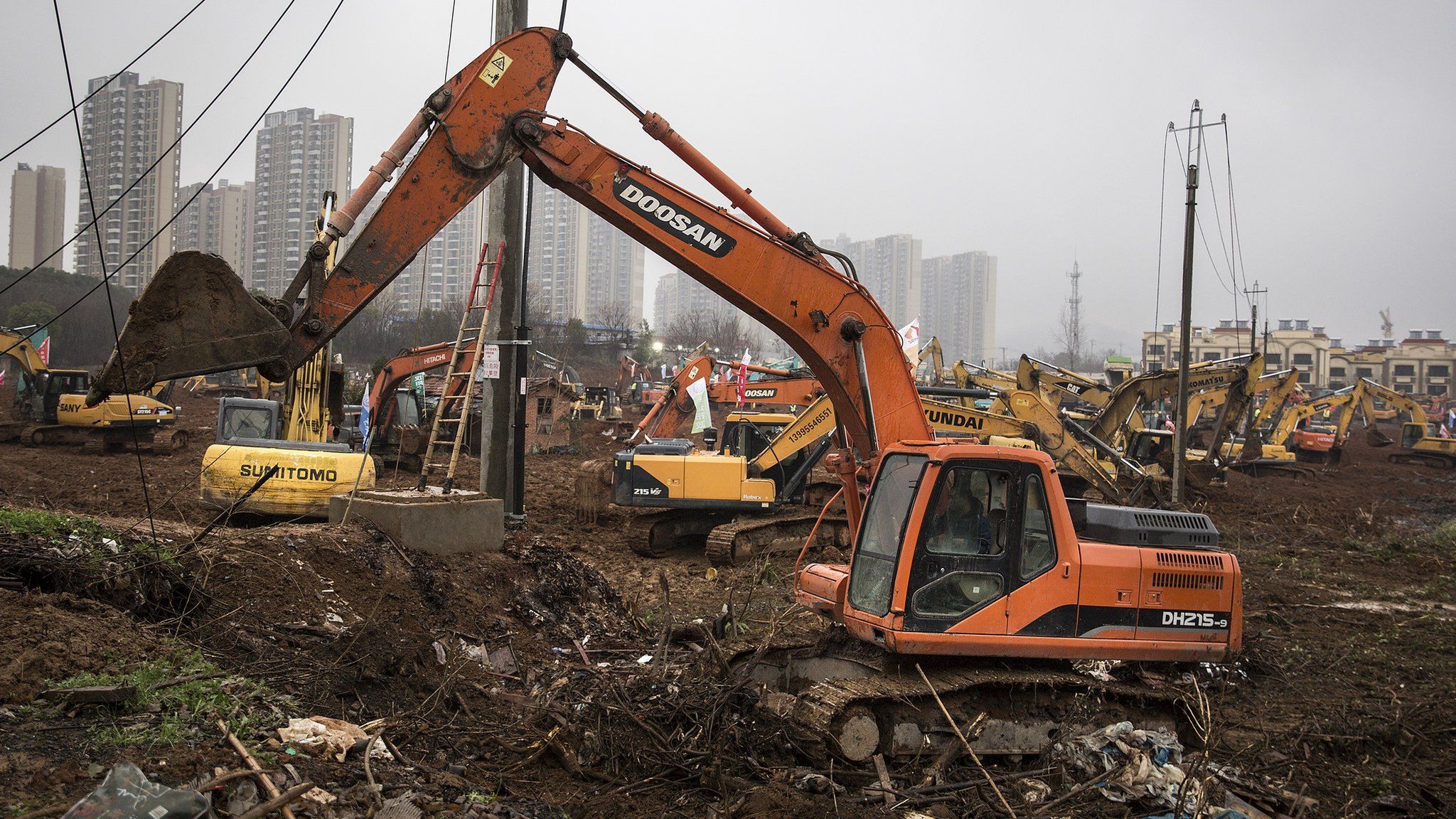 Diggers on the site of the hospital in Wuhan
