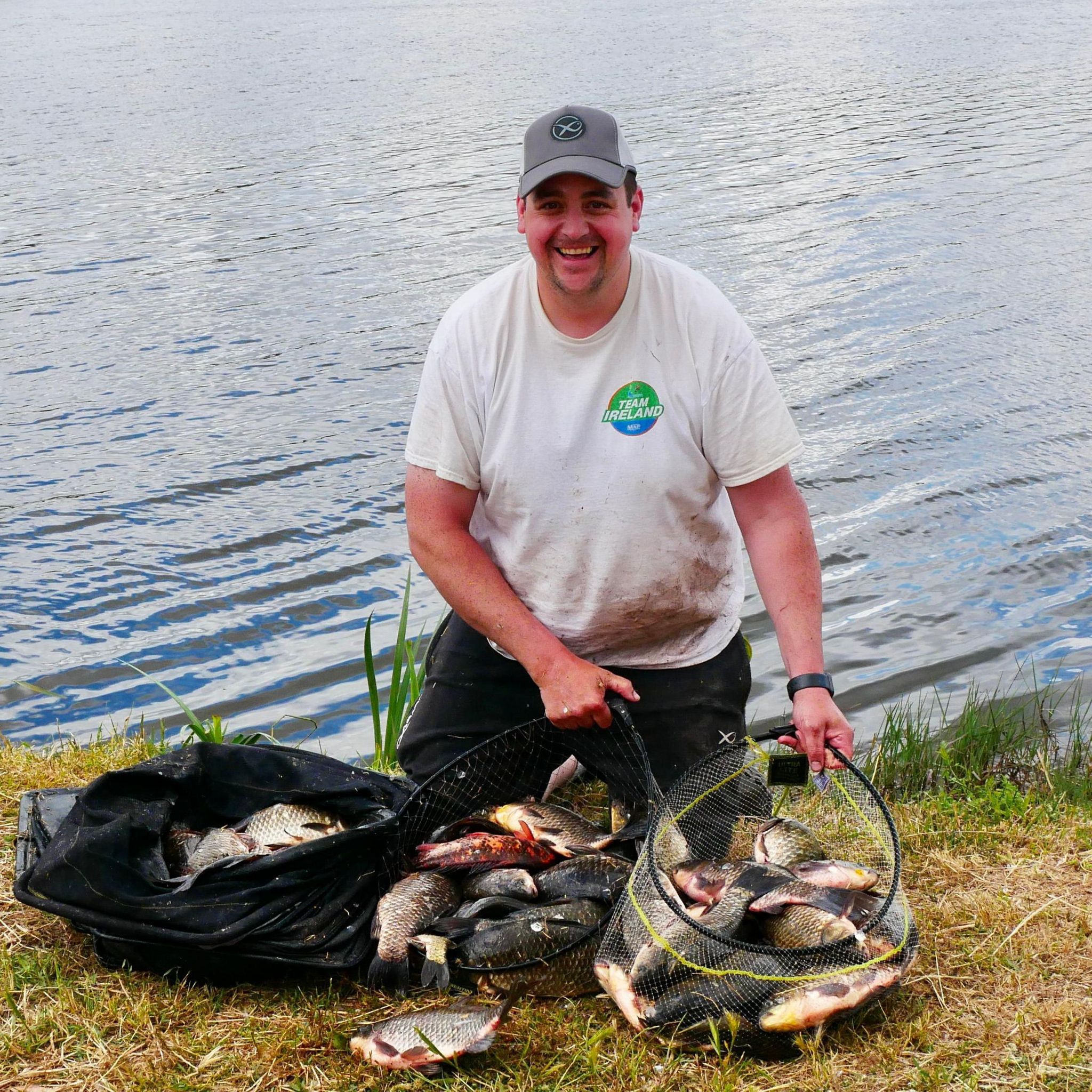 Johnny McKinley pictured in his team Ireland tshirt beside water