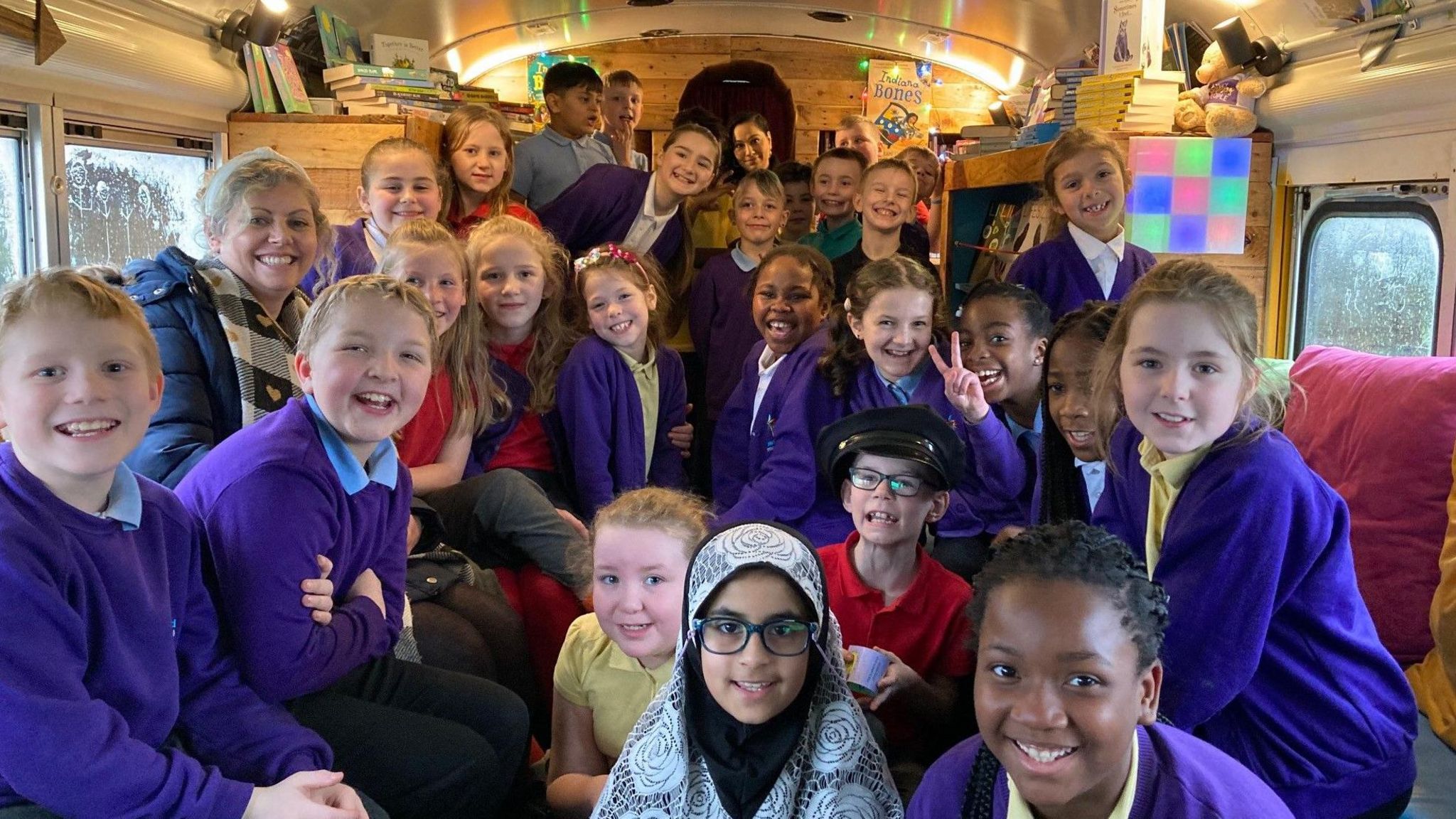 Smiling children on the Bradford book bus
