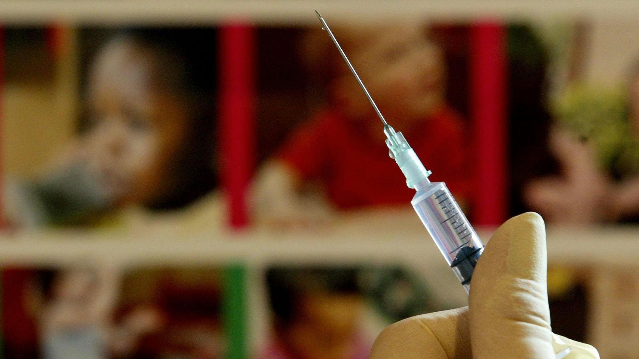 A nurse handling a syringe at a medical centre 