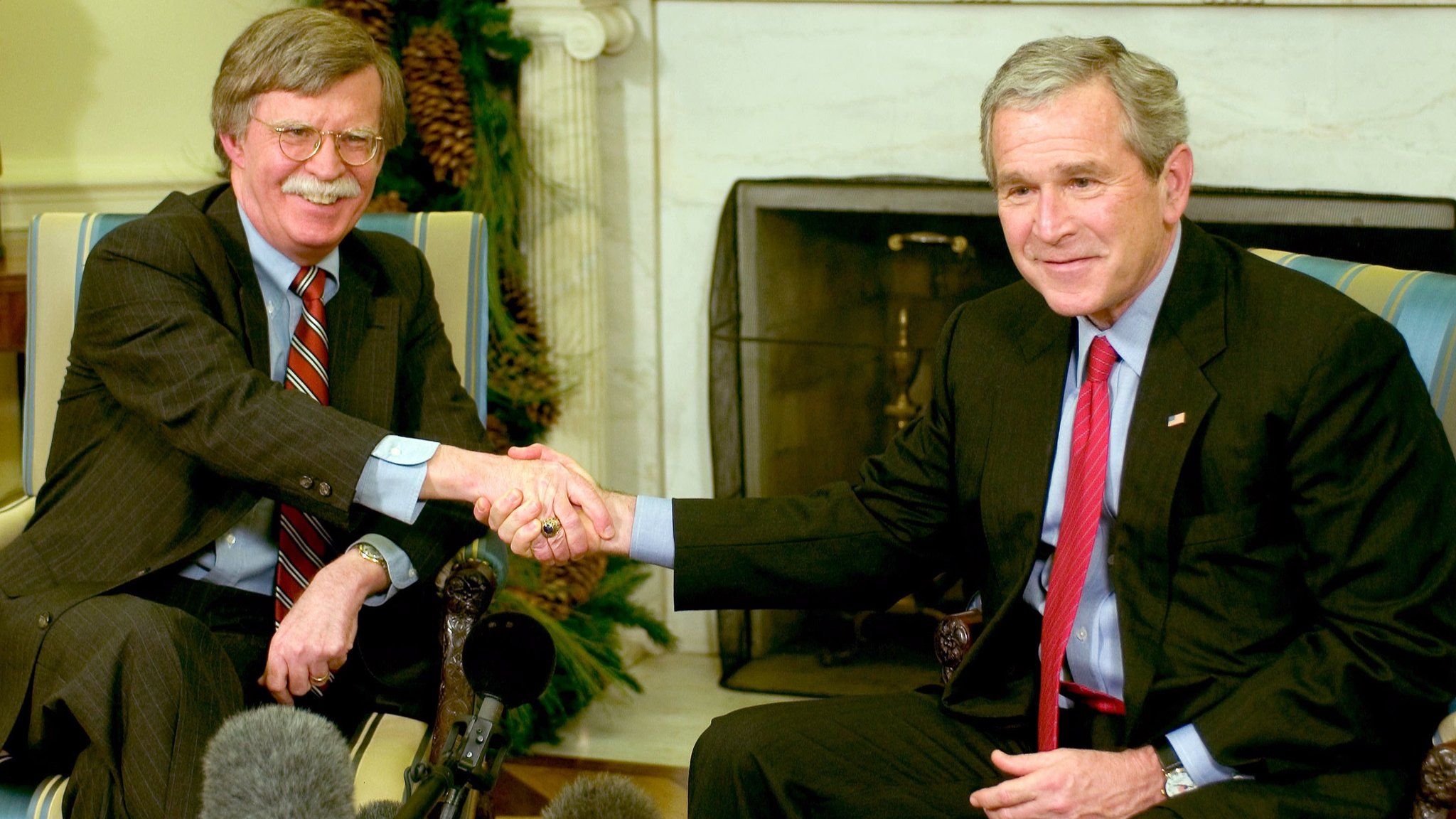 US President George W. Bush (R) and Ambassador to the UN John Bolton (L) meet in the Oval Office of the White House December 4, 2006 in Washington, DC.