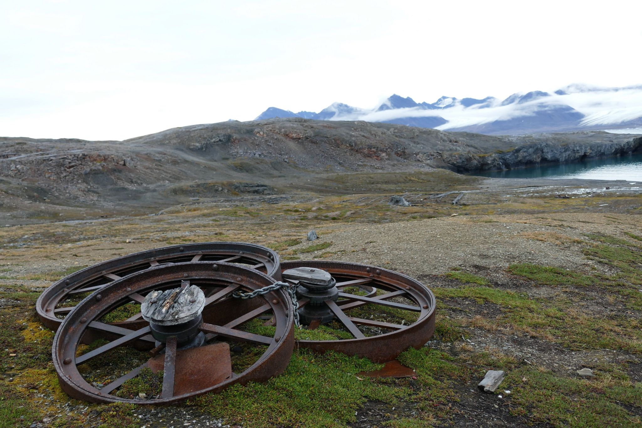 Abandoned wheels at the site of former mining settlement in the Svalbard archipelago's Arctic island of Blomstrandøya