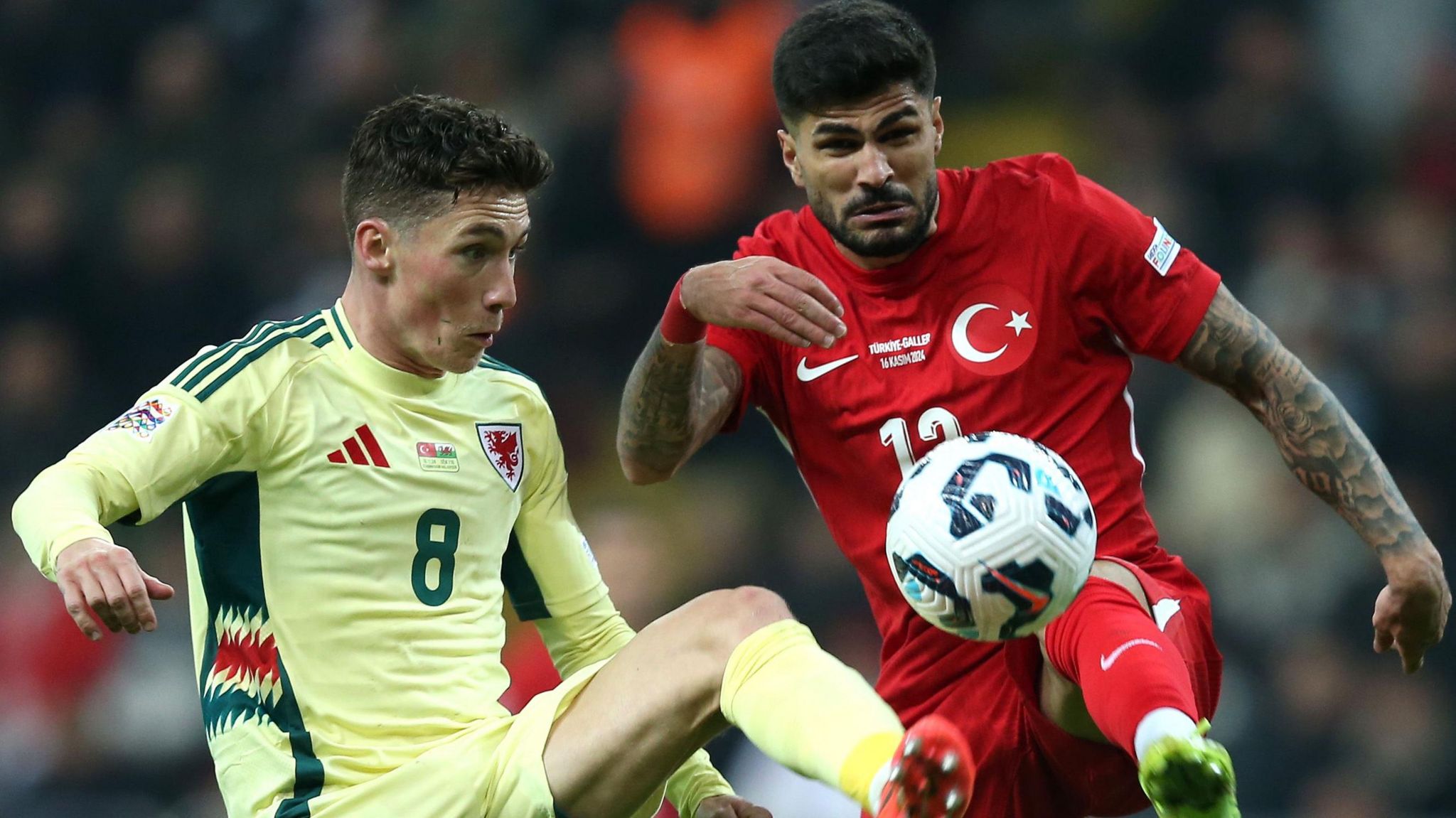 Harry Wilson of Wales (L) battles for possession with Eren Elmali of Turkey 