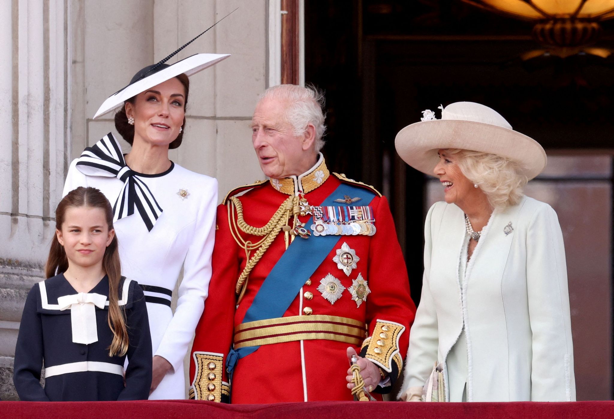 Princess of Wales, Princess Charlotte, King Charles and Queen Camilla appear on the balcony of Buckingham Palace