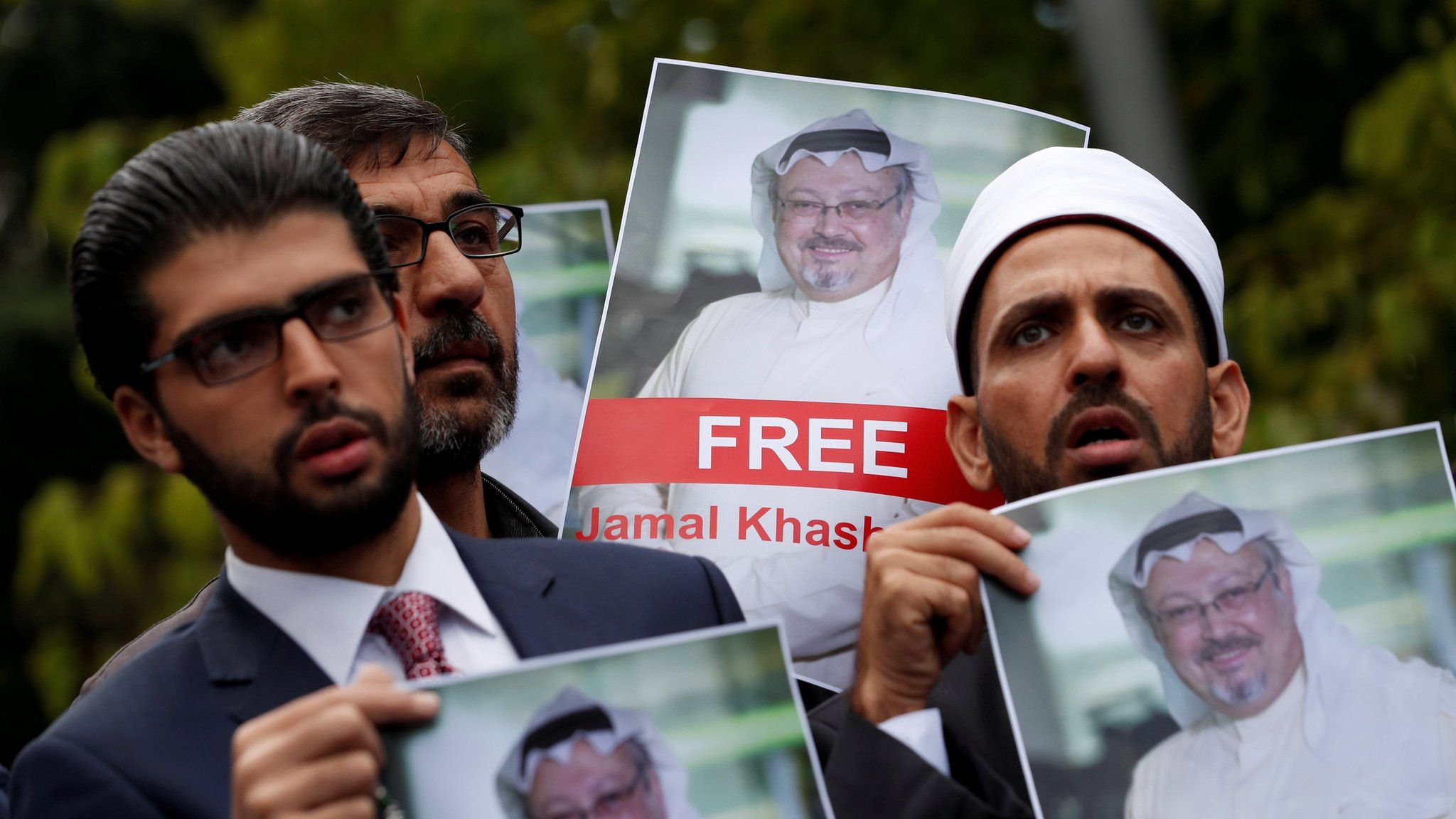 Human rights activists and friends of Saudi journalist Jamal Khashoggi hold his picture during a protest outside the Saudi Consulate in Istanbul, Turkey October 8, 2018