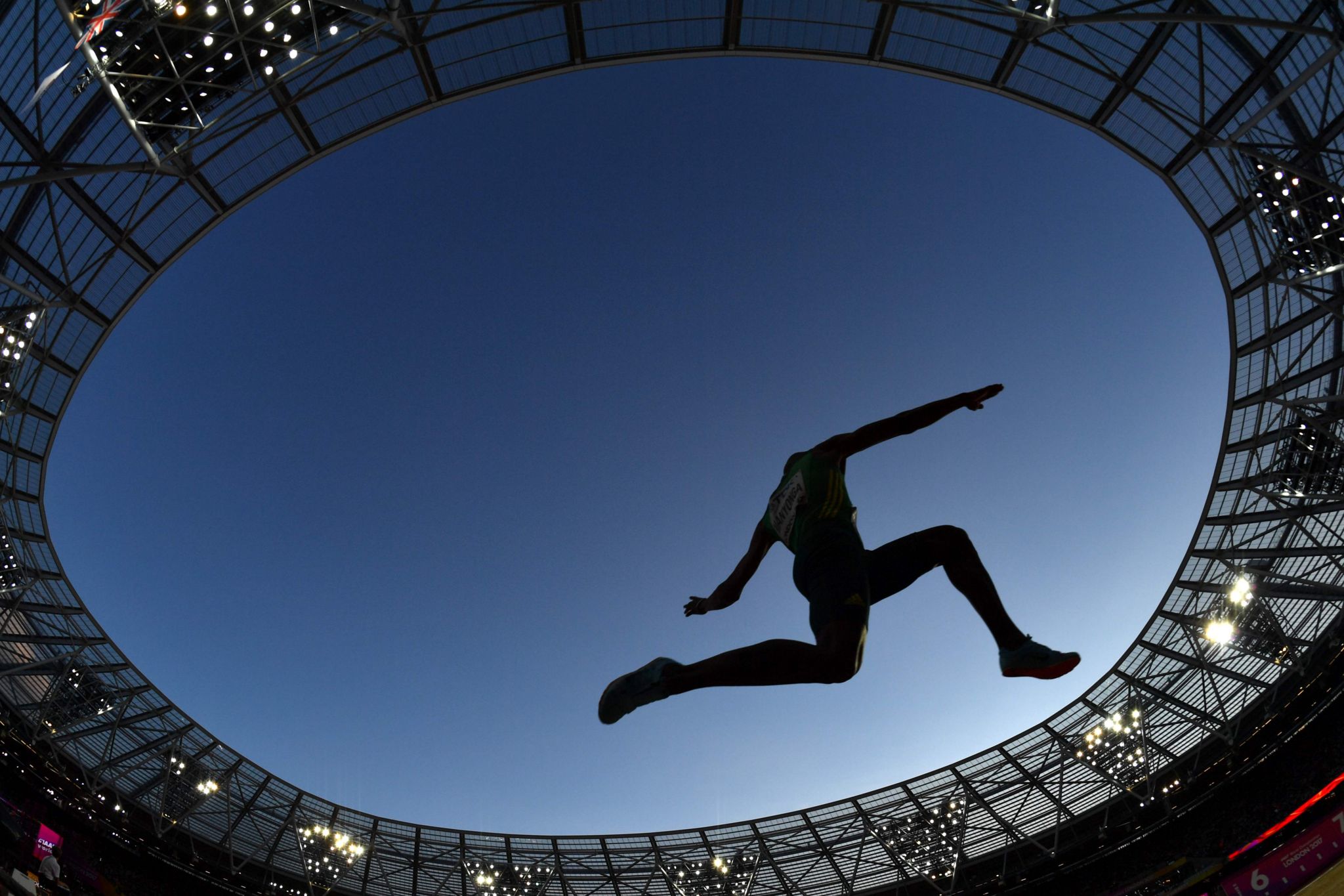 Luvo Manyonga mid-jump