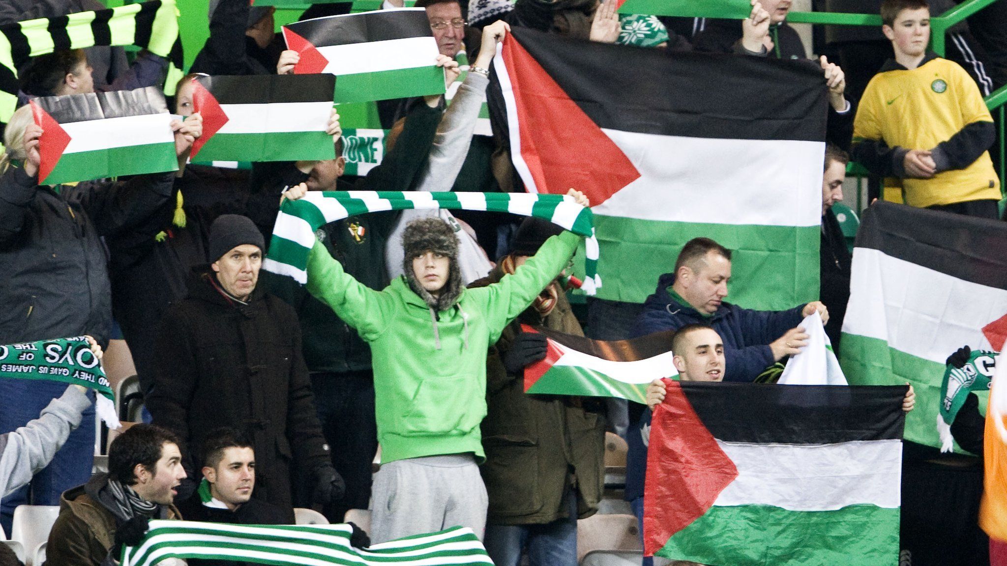 Fans display Palestine flags at Celtic's Champions League play-off first leg against Hapoel Beer Sheva