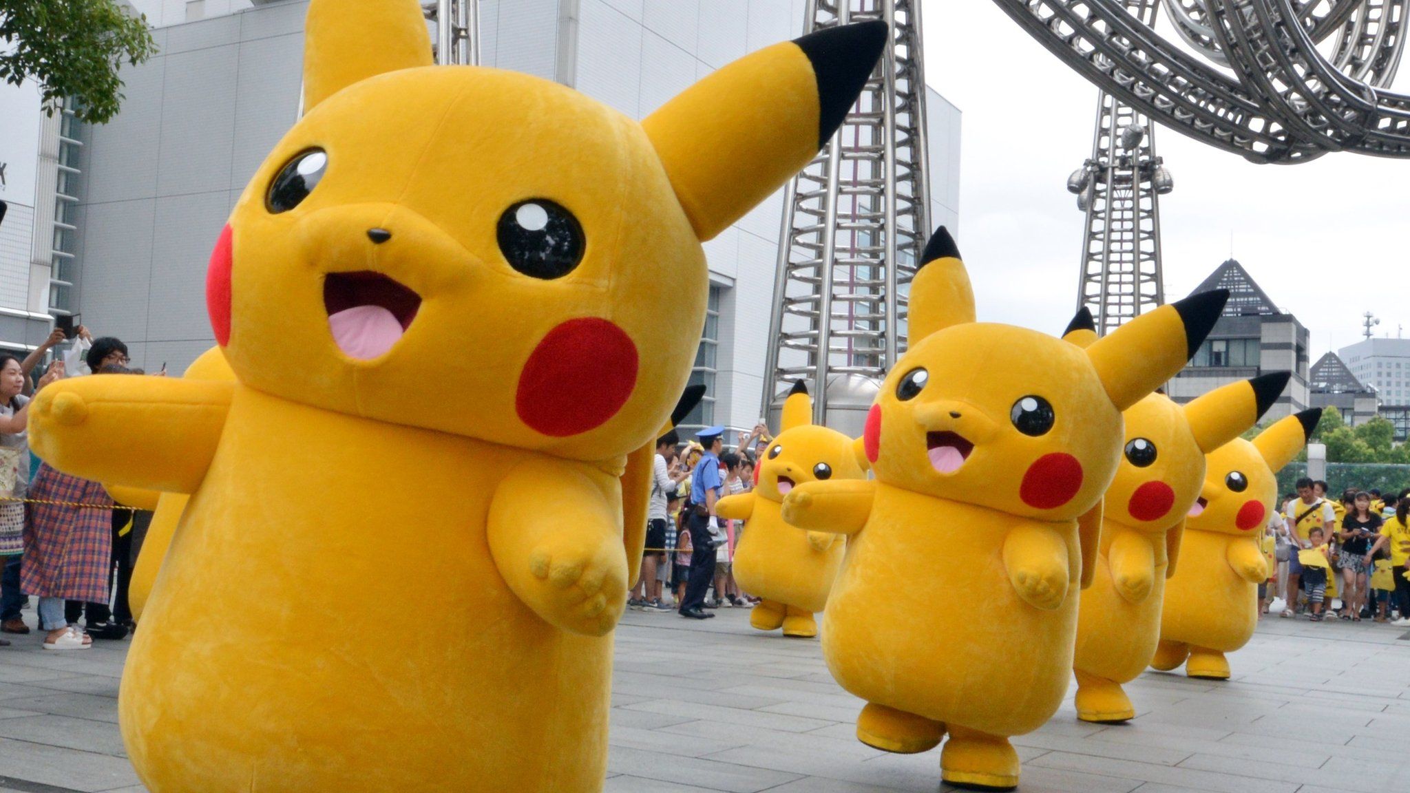 A line of Pikachu cosplayers